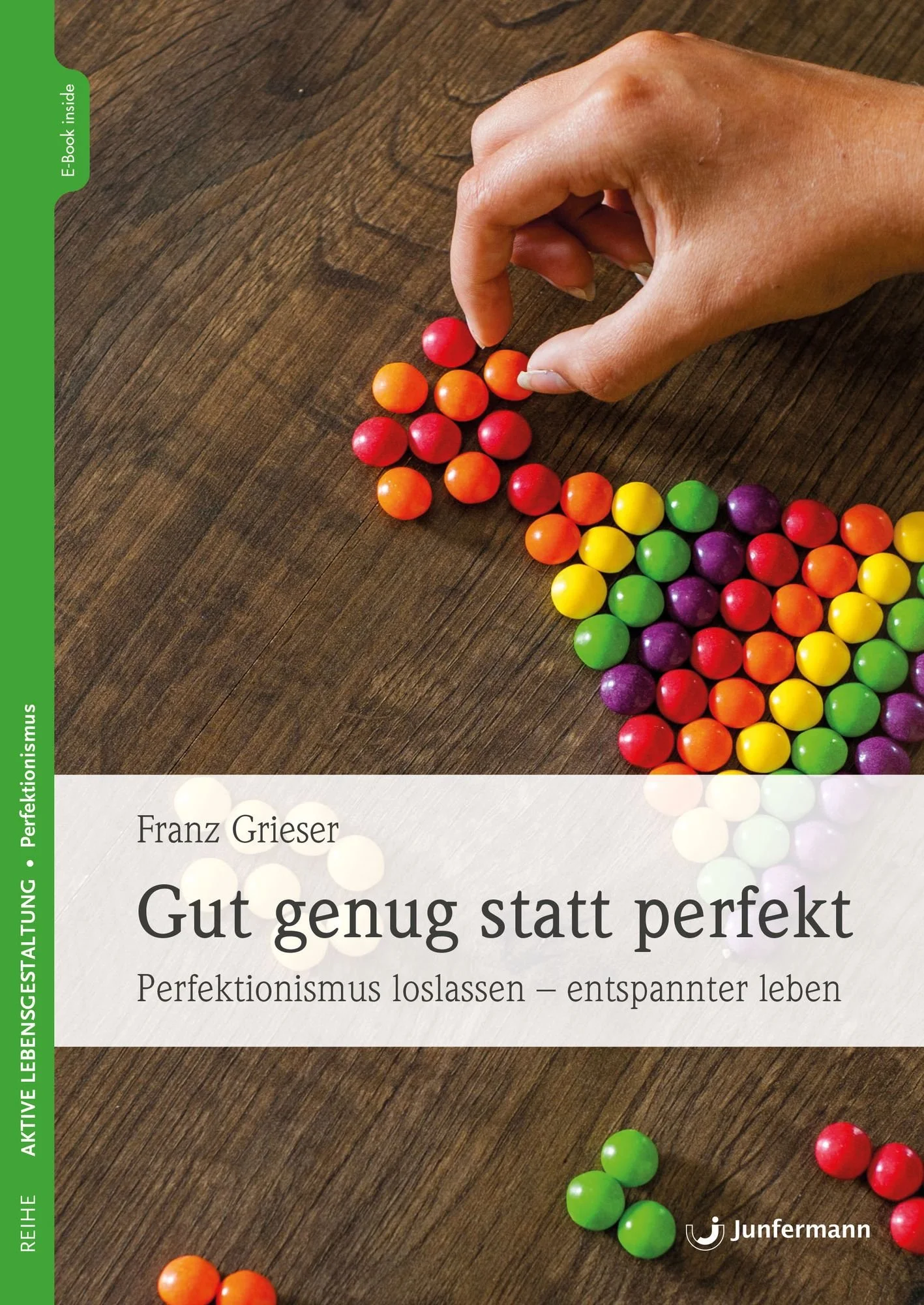 Buchcover mit bunten Kugeln und Titel 'Gut genug statt perfekt' von Franz Grieser.
