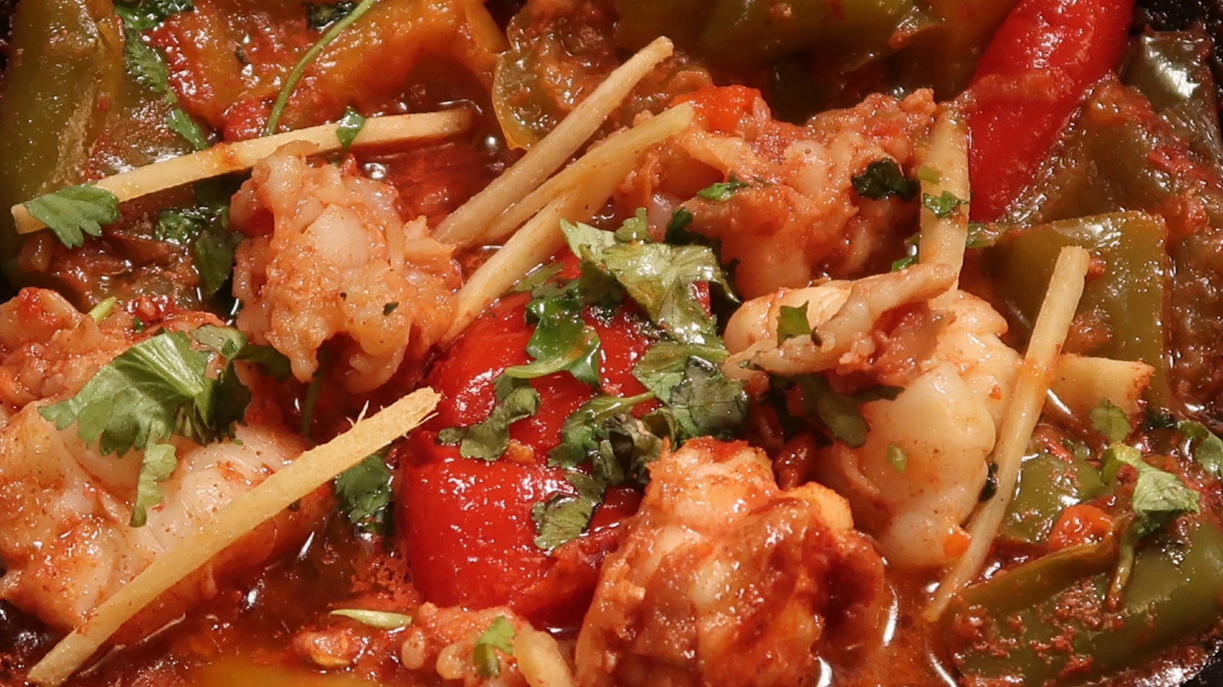 Chilli King Prawn | Fresh king prawns cut and prepared with fresh mixed peppers in our capsicum curry sauce.