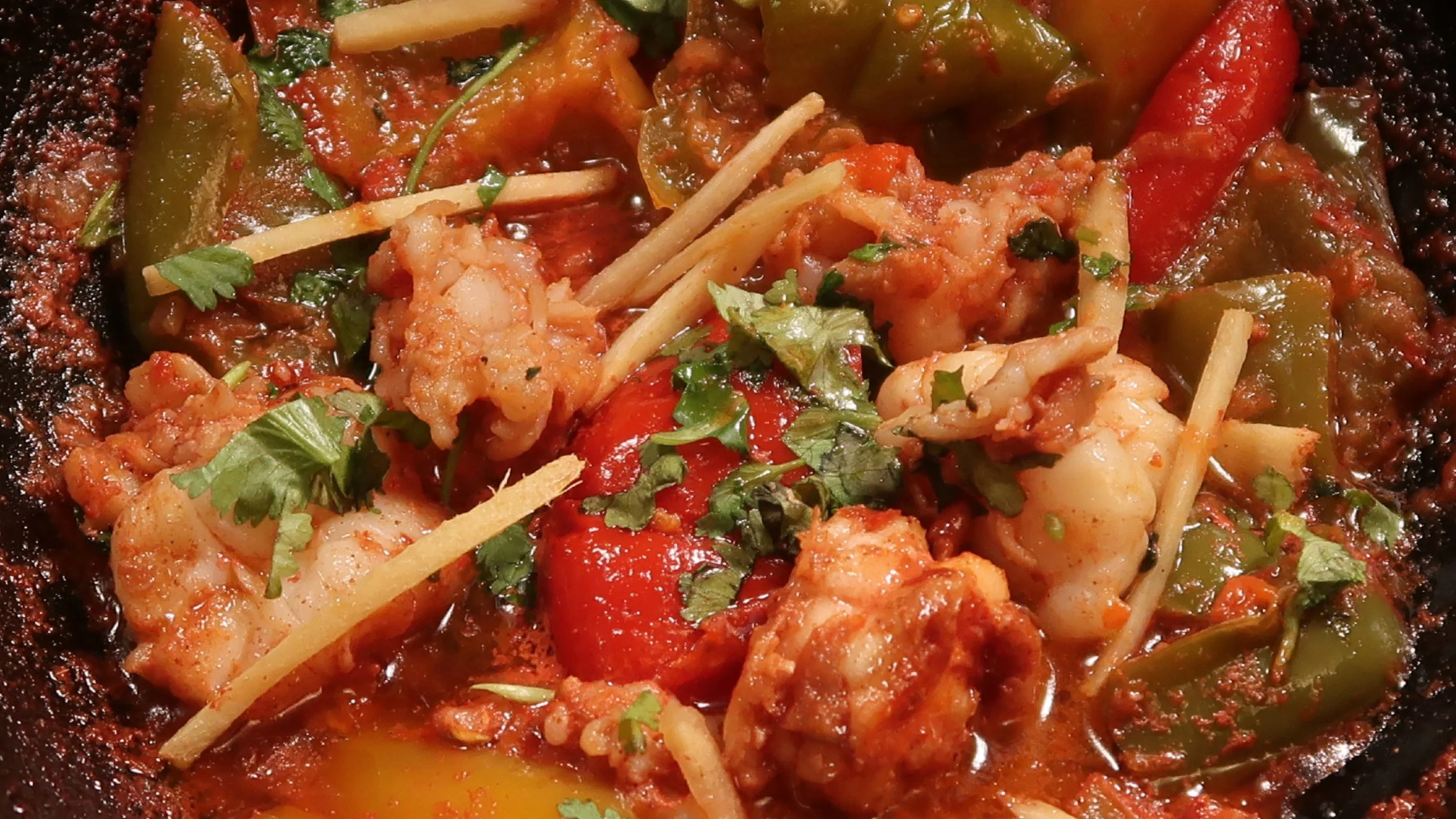 Chilli King Prawn | Fresh king prawns cut and prepared with fresh mixed peppers in our capsicum curry sauce.
