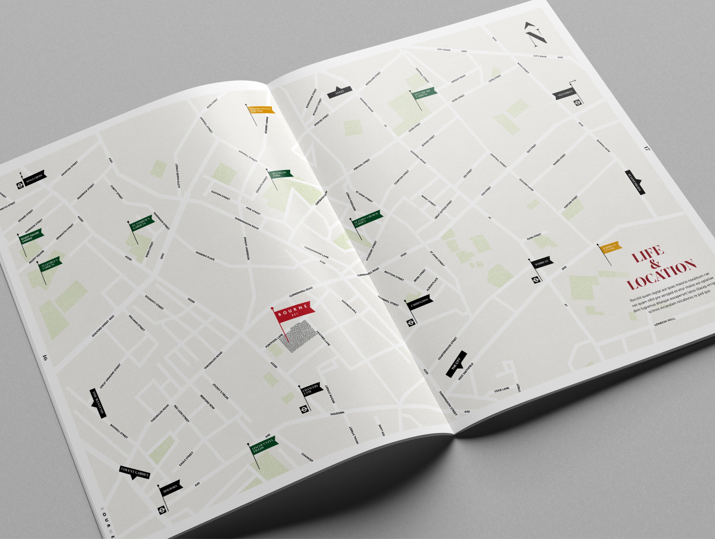 An open city map with street names and location markers, laid out on a flat surface.