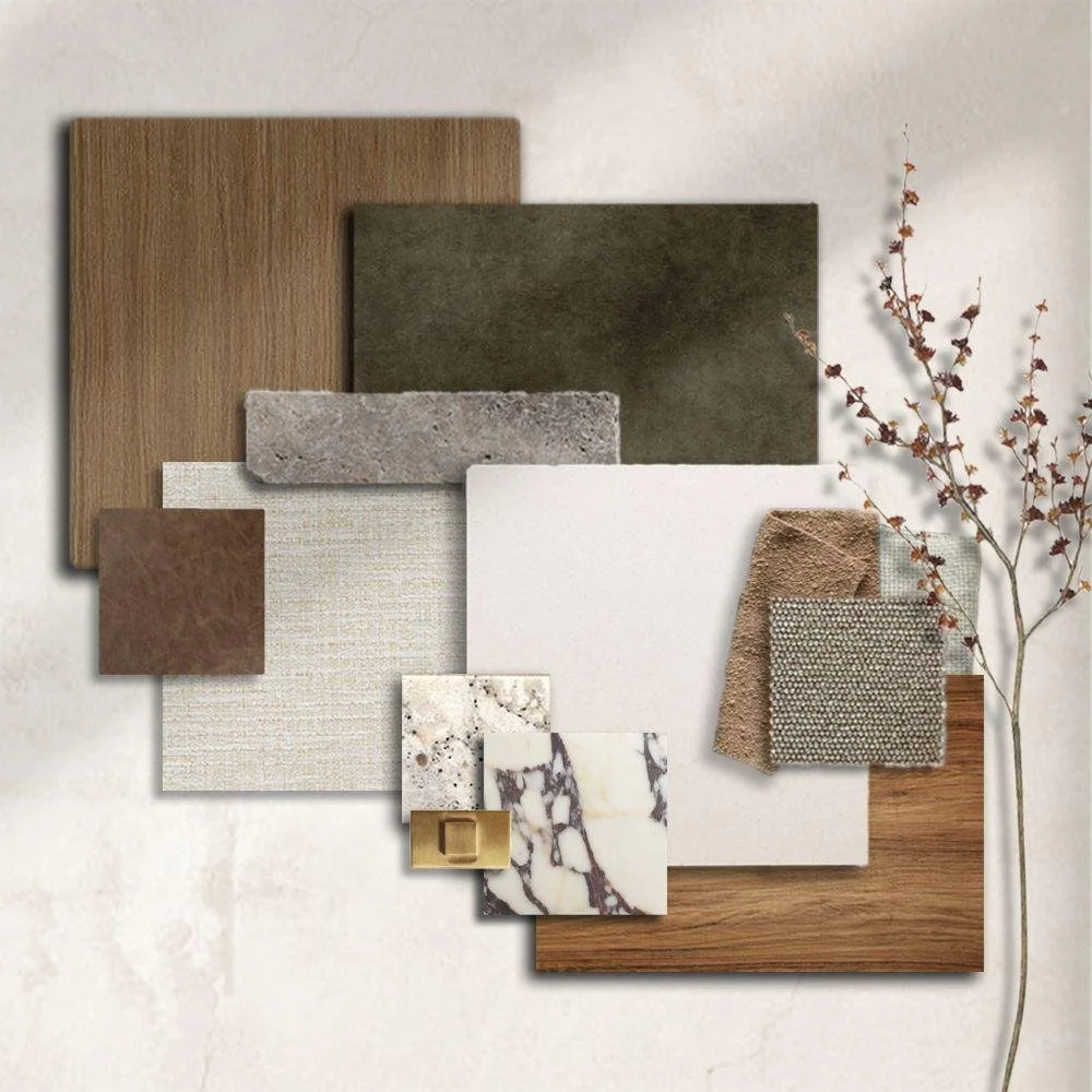 Sample materials for interior design including wood, stone, fabric, and marble textures, arranged on a white background with a small dried branch.