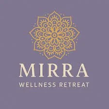 Logo for Mirra Wellness Retreat with a gold ornate floral design on a purple background.
