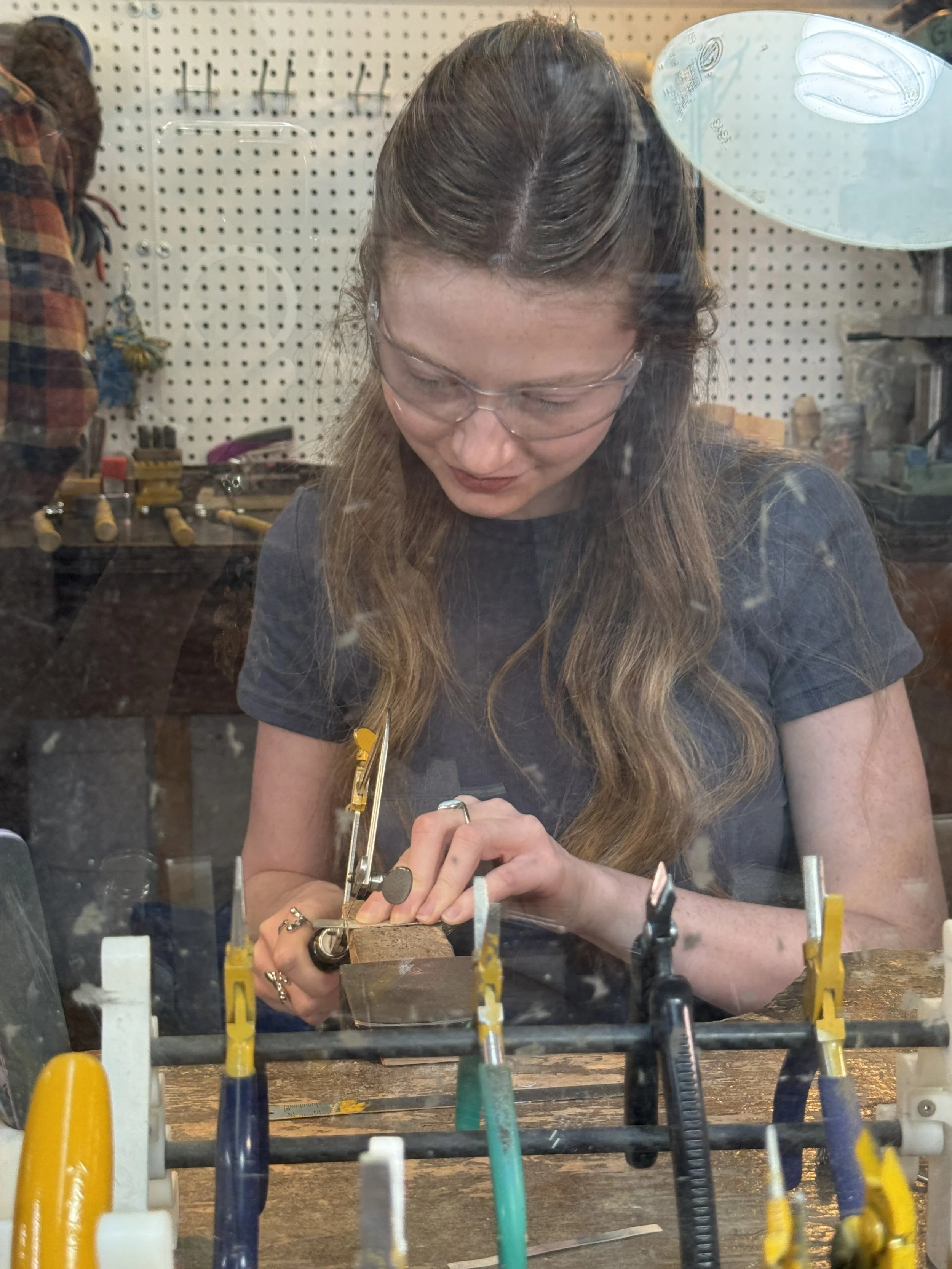 Silversmith making silver jewelry. Silver jewellery. Canadian business woman.  Local Canadian Business.  Canadian Jewelry. British Columbia Canada.  Canada.