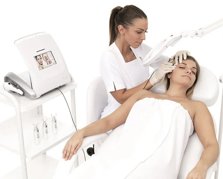 Specialist performing a facial treatment in a beauty studio