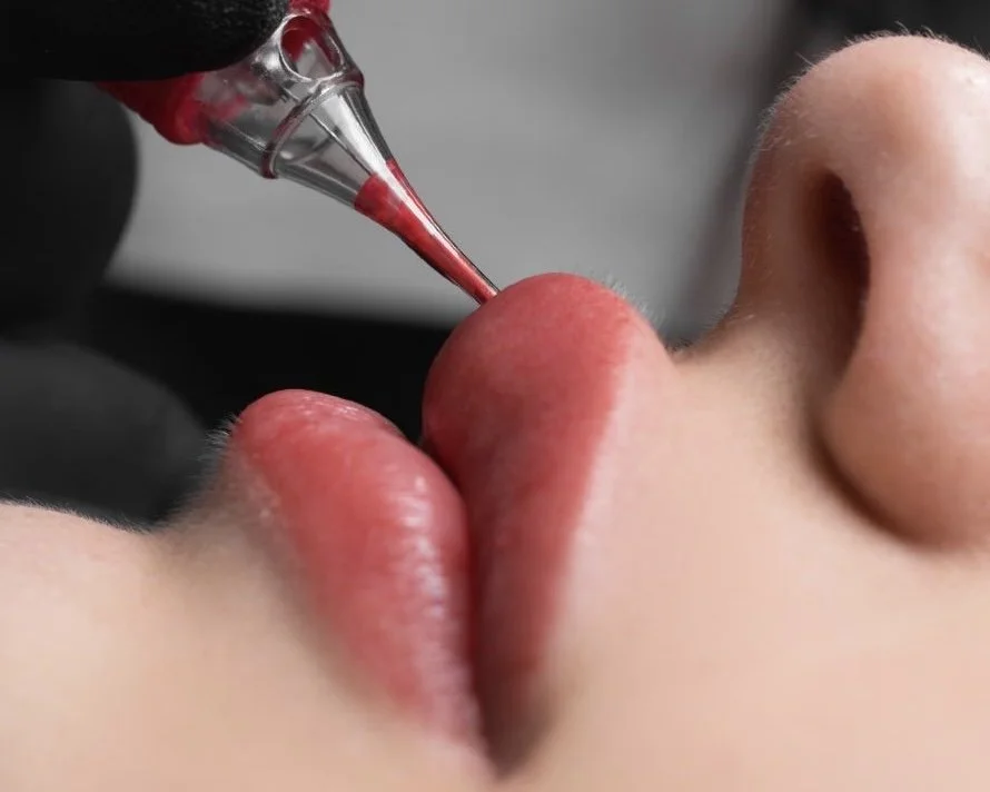 Close-up of a lip permanent makeup procedure