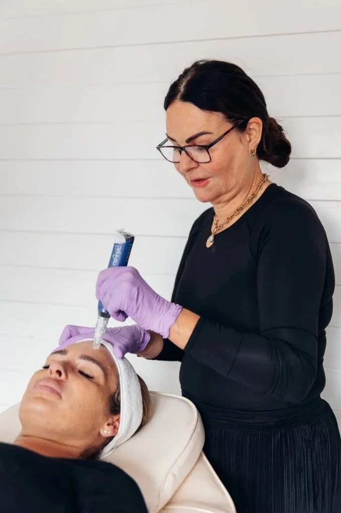 A microneedling professional performing treatment on a woman to minimise wrinkles, improve skin texture and boost collagen at a skin rejuvenation clinic in bournemouth