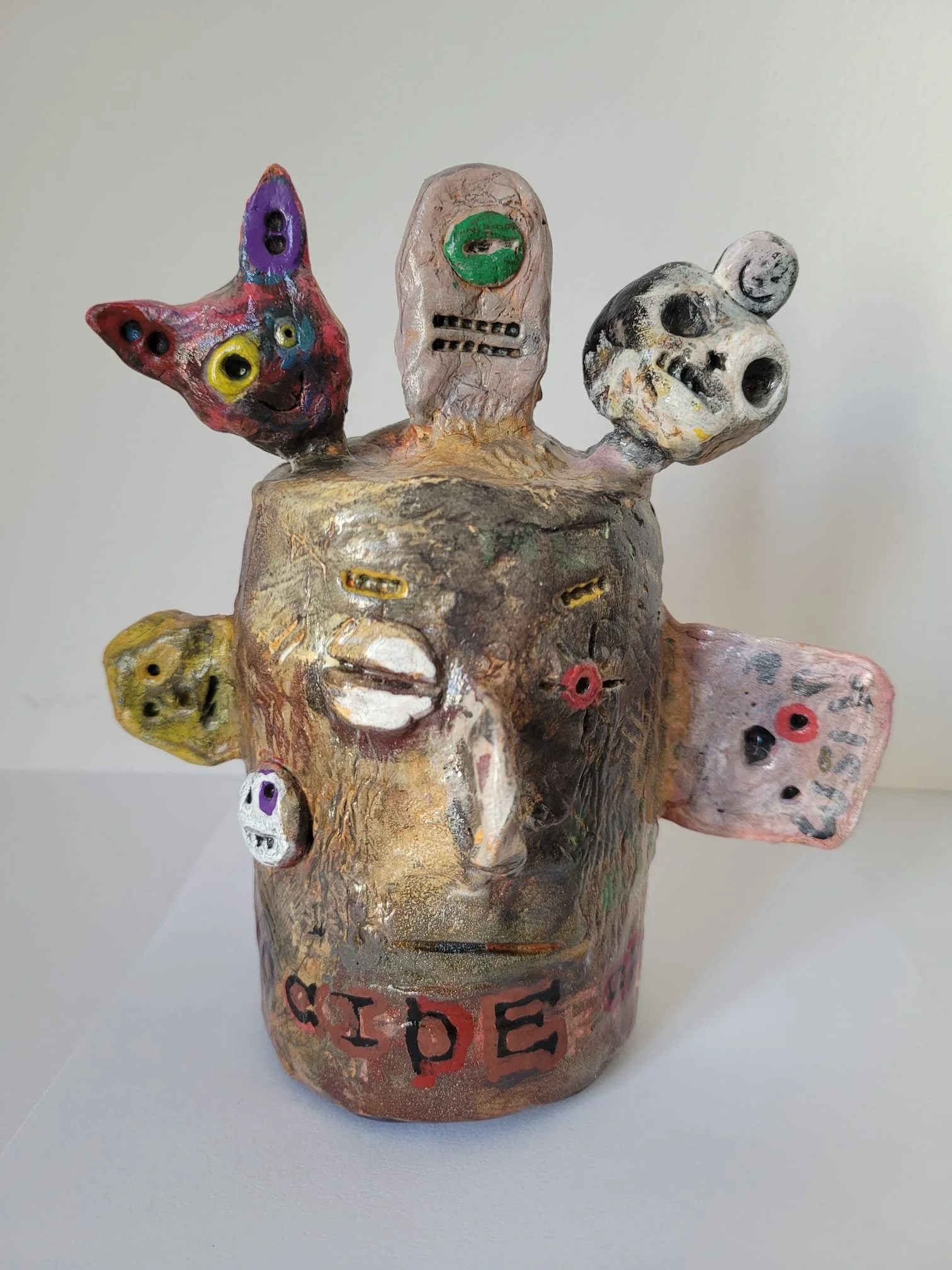 Chin Hippy (two sides) 2026 clay and mixed media 8"x10" (20x26cm)