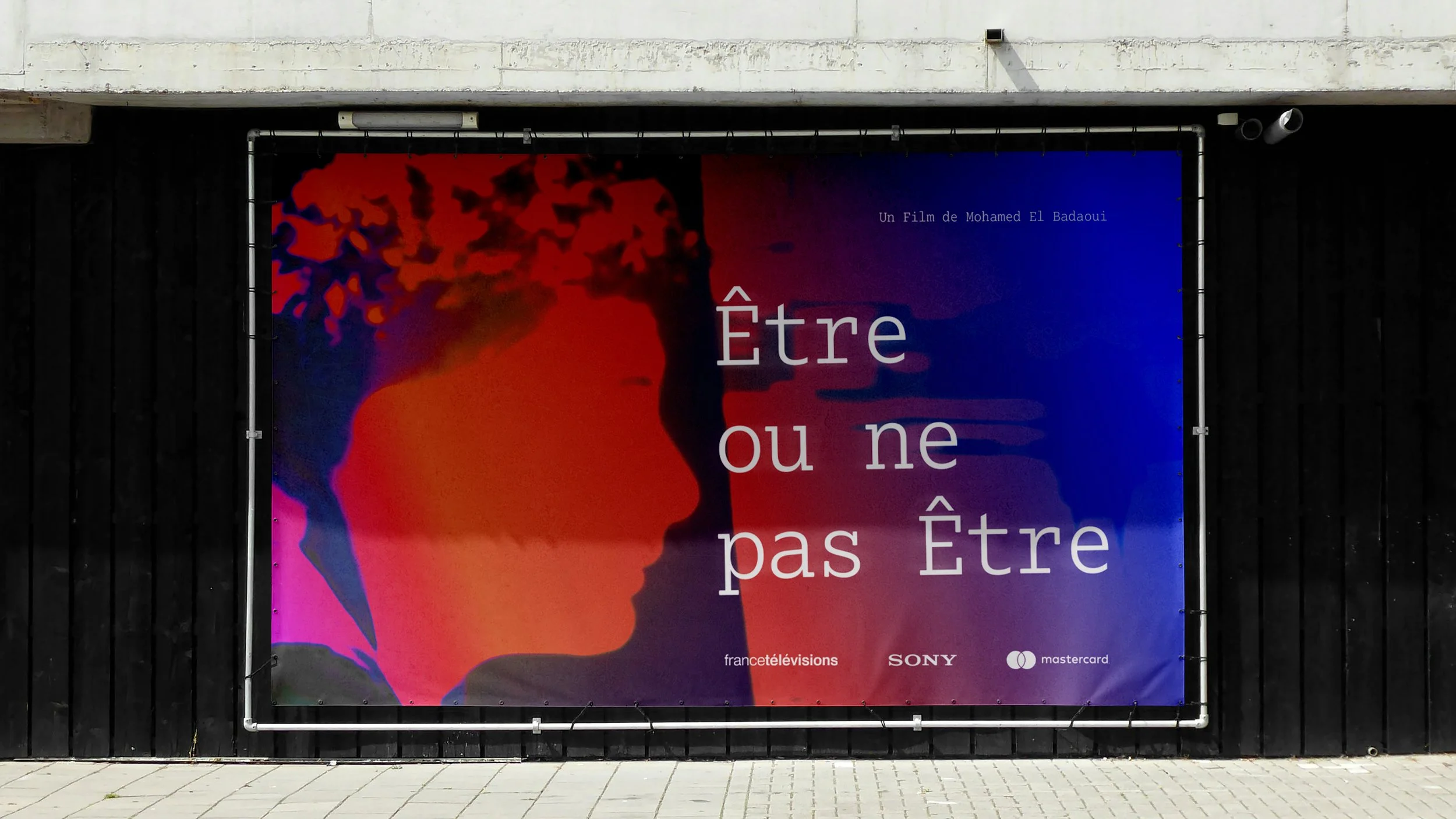 Free Banner Attached to Black Wall Mockup.jpg
