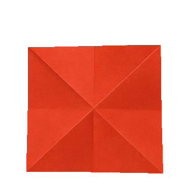 A red square folded paper napkin with a star pattern.