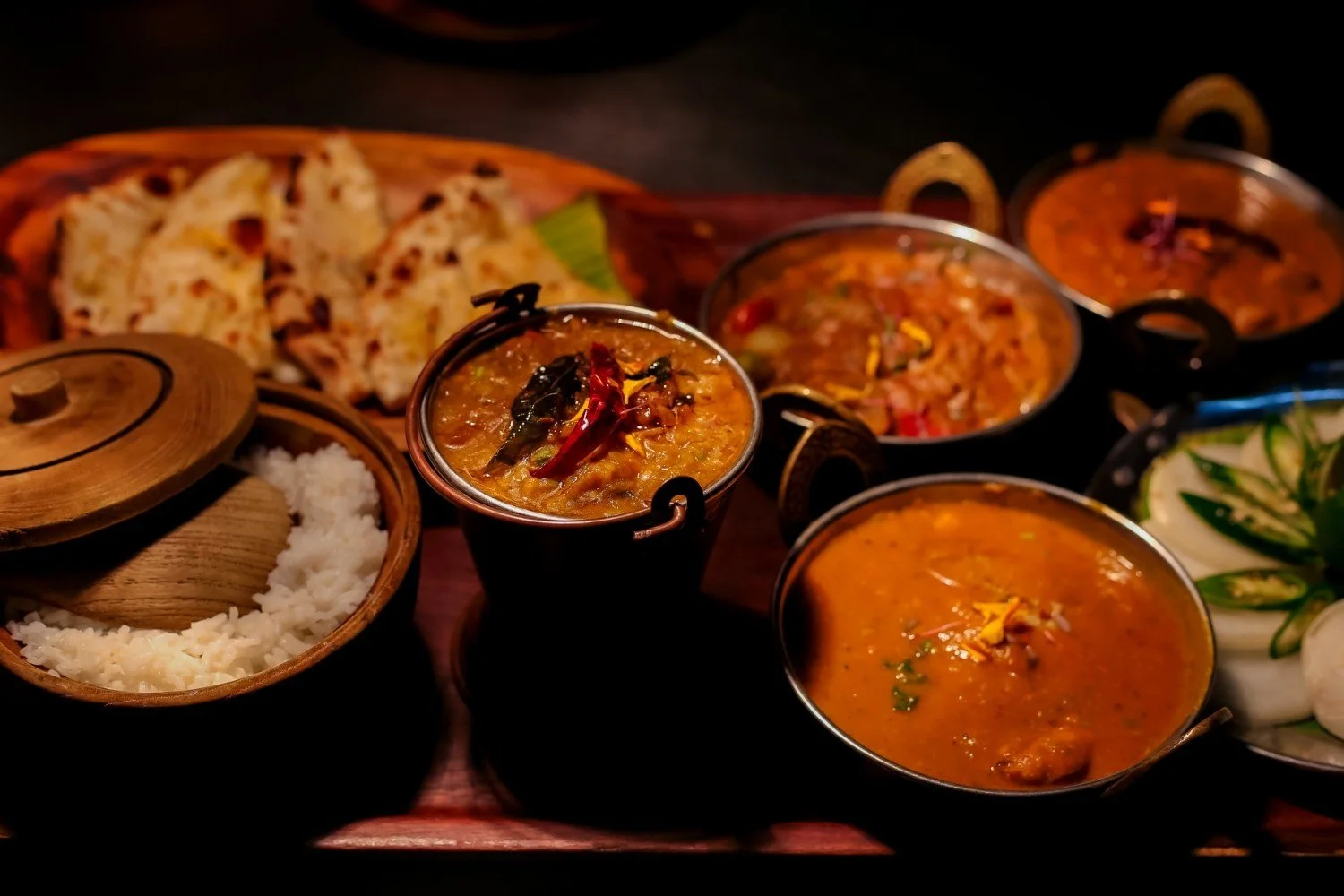 Traditional Indian curry, naan, and rice at Pesona Beach Resort & Spa