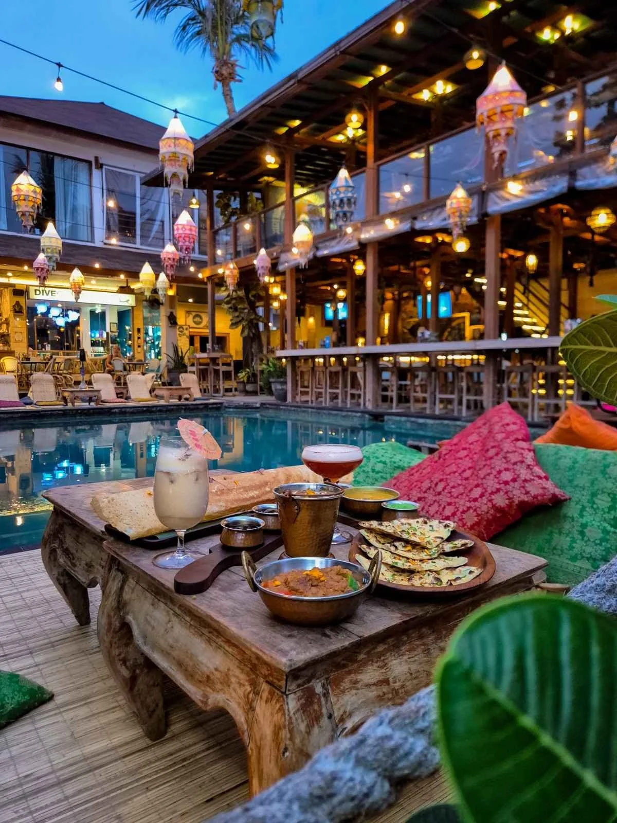 Indian dishes and drinks served beside the pool at Pesona Lounge Trawangan