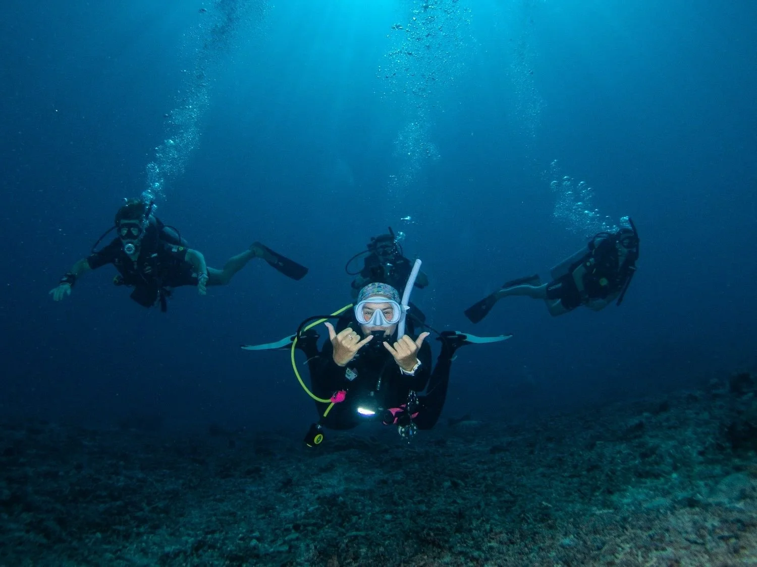 Group of scuba divers exploring the waters of Gili Trawangan