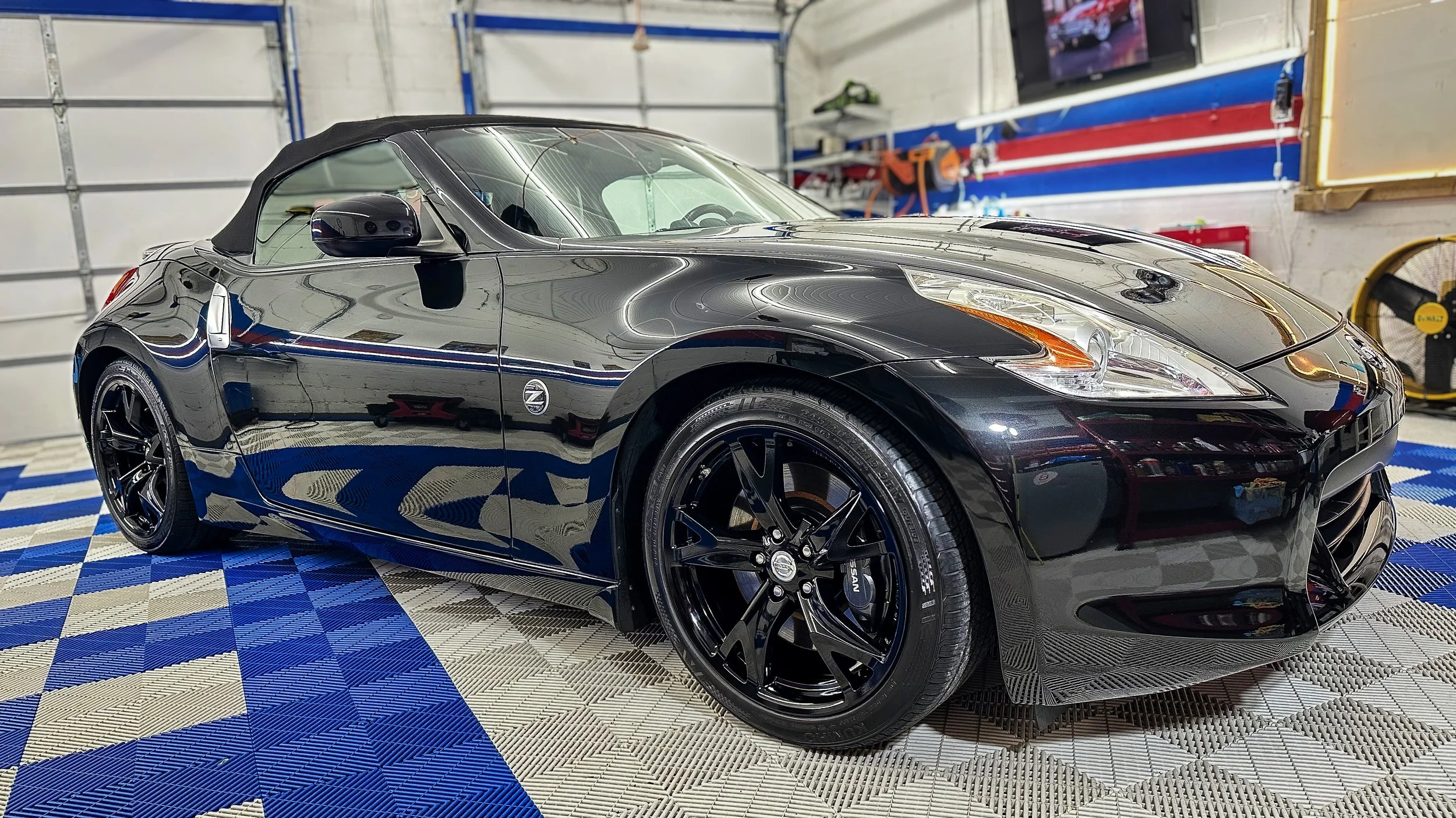 Black Nissan sports car professionally detailed.