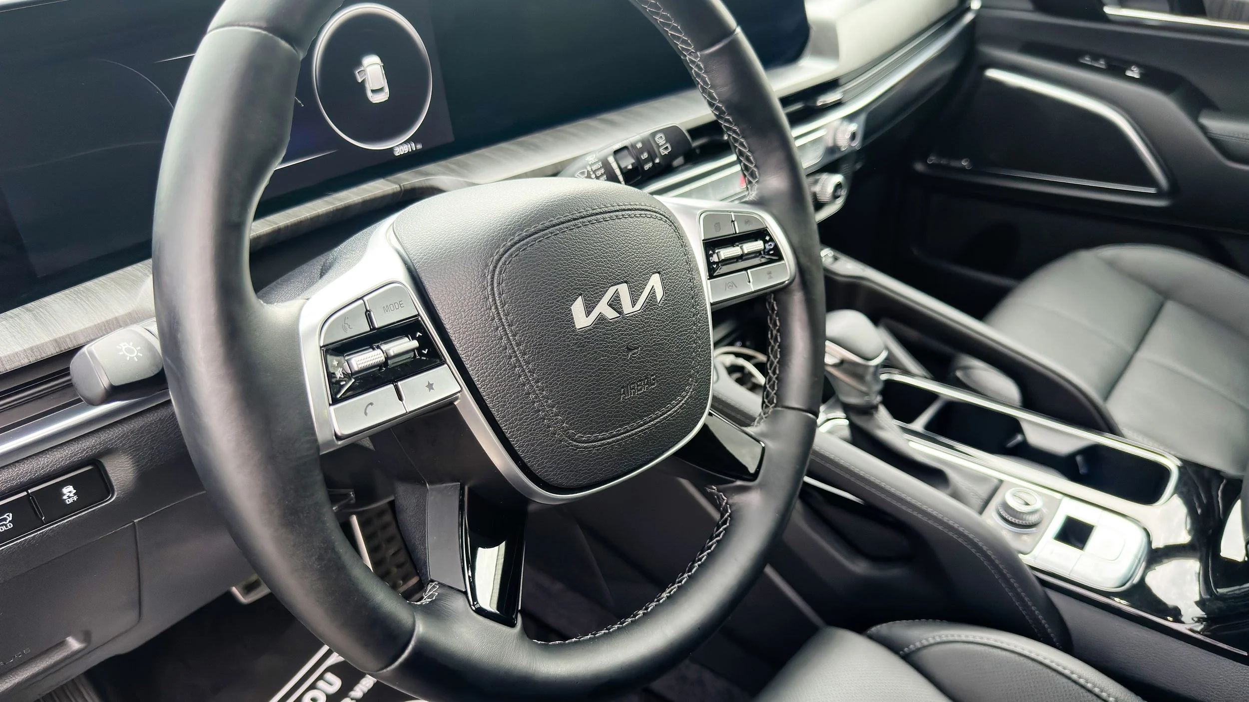 Kia vehicle interior with clean dashboard and center console, interior detailing, Luxdream car detailing