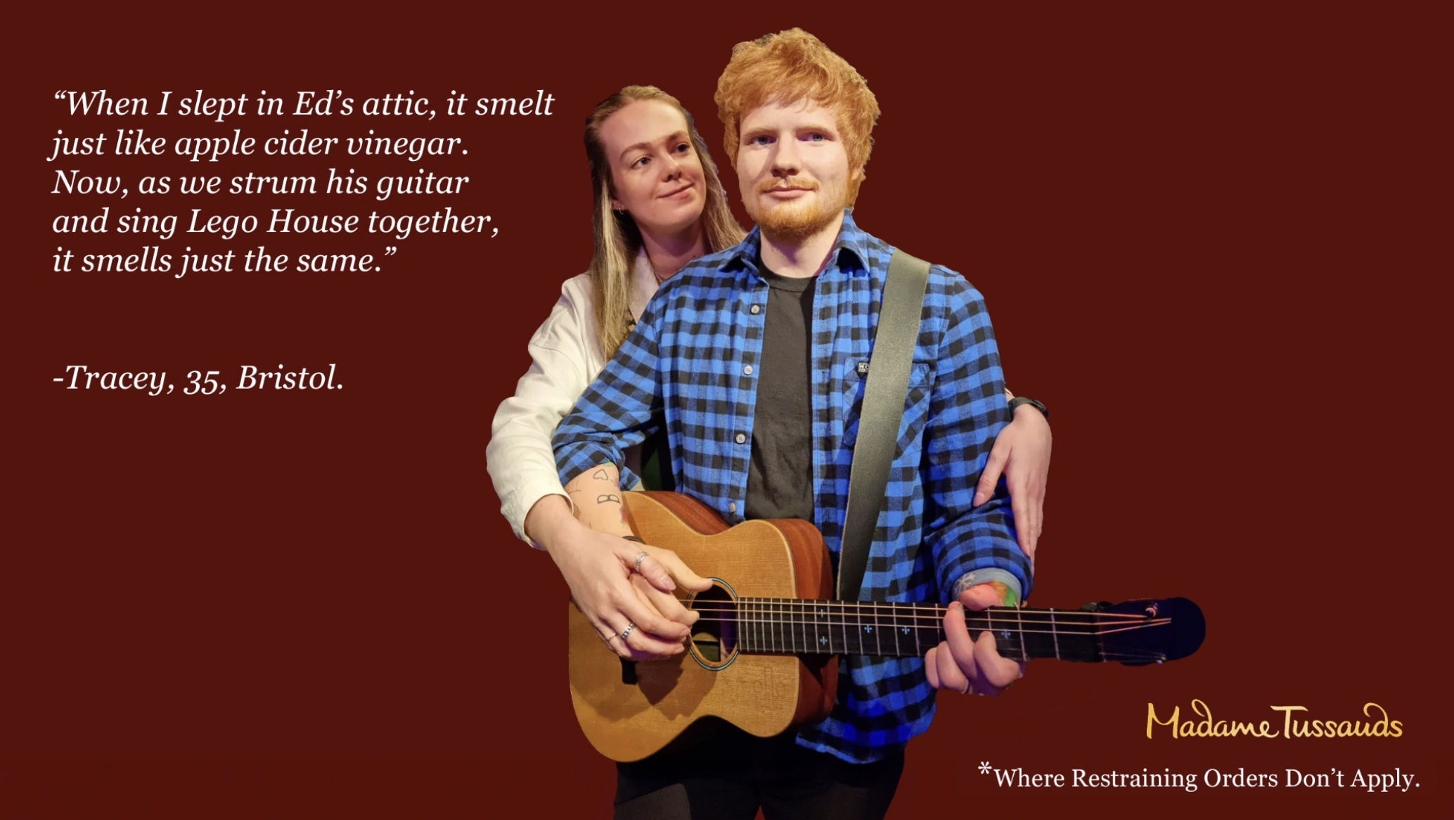 A woman and a man with red hair, standing together, with the woman slightly behind and to the side of the man. The woman has long blonde hair and is wearing a white jacket, while the man is playing a guitar, wearing a blue plaid shirt and has a tattoo on his forearm. They are standing against a red background with white text including a quote and attribution.