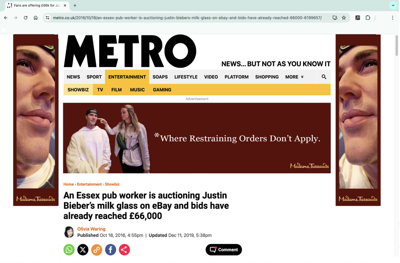 Screenshot of a news article on the Metro website with a headline about an Essex pub worker auctioning Justin Bieber's milk glass on eBay, with images of Justin Bieber and a woman, and Madame Tussauds ads on the sides.