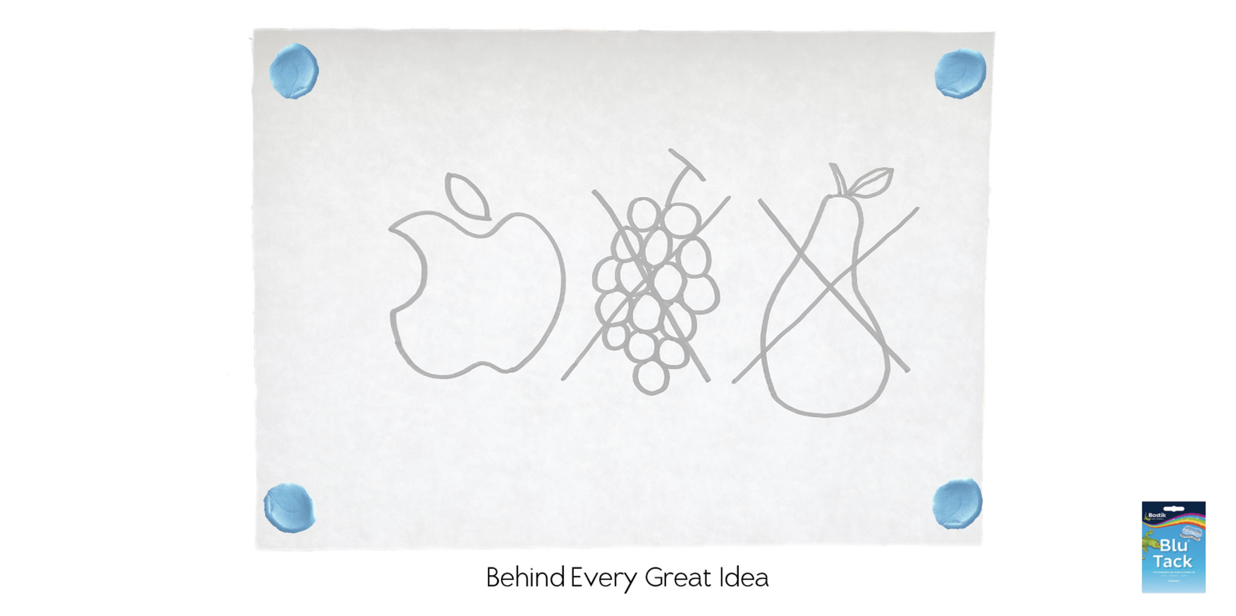 A white piece of paper with a simple outline drawing of an apple, a bunch of grapes, and a bottle. The paper is tacked to a surface with four blue push pins, one in each corner. There is a logo in the bottom right corner for Blu Tack, and a phrase at the bottom of the paper that reads "Behind Every Great Idea."