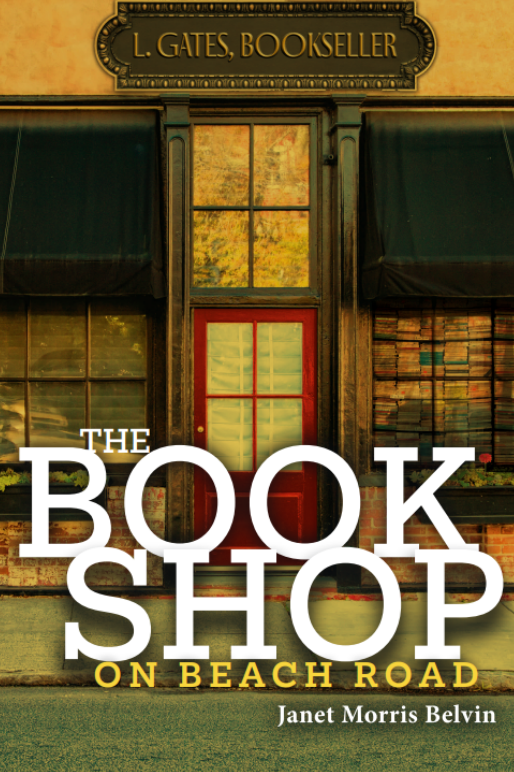 Book cover titled 'The Bookshop on Beach Road' by Janet Morris Belvin, featuring a storefront with large windows, a red door, and the sign 'L. Gates, Bookseller' mounted above.