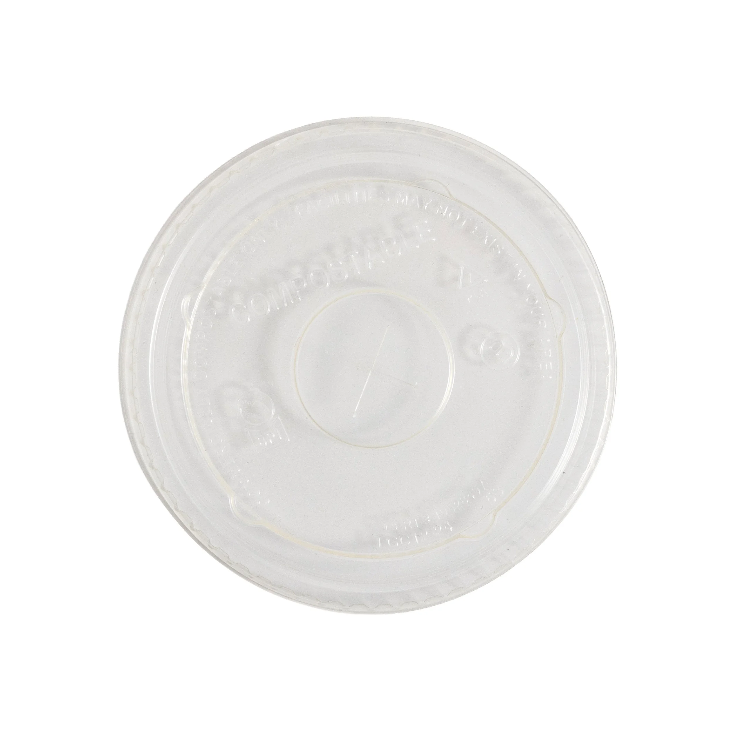 Close-up of a clear plastic container lid with embossed text and designs.