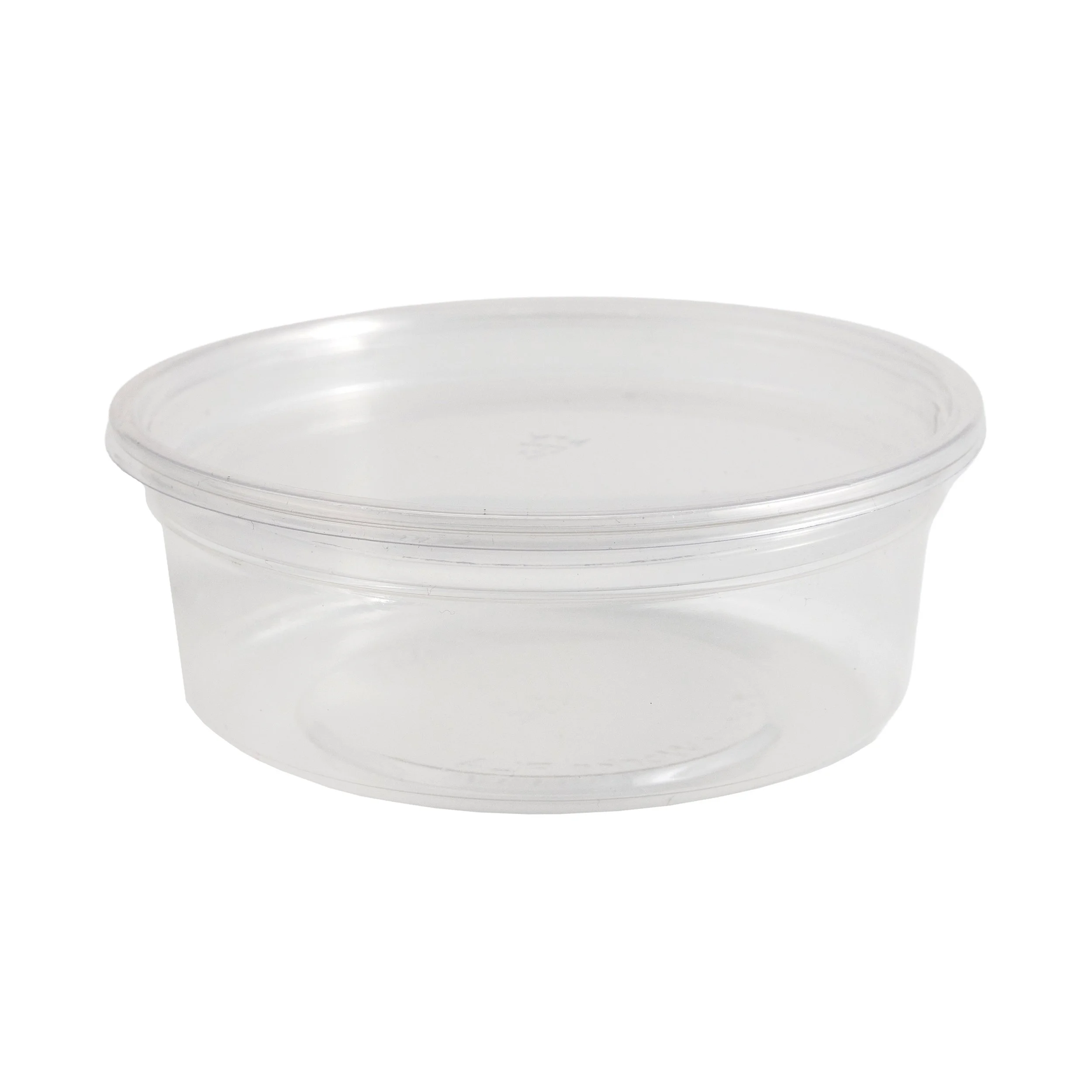 A clear plastic container with a white lid underneath.
