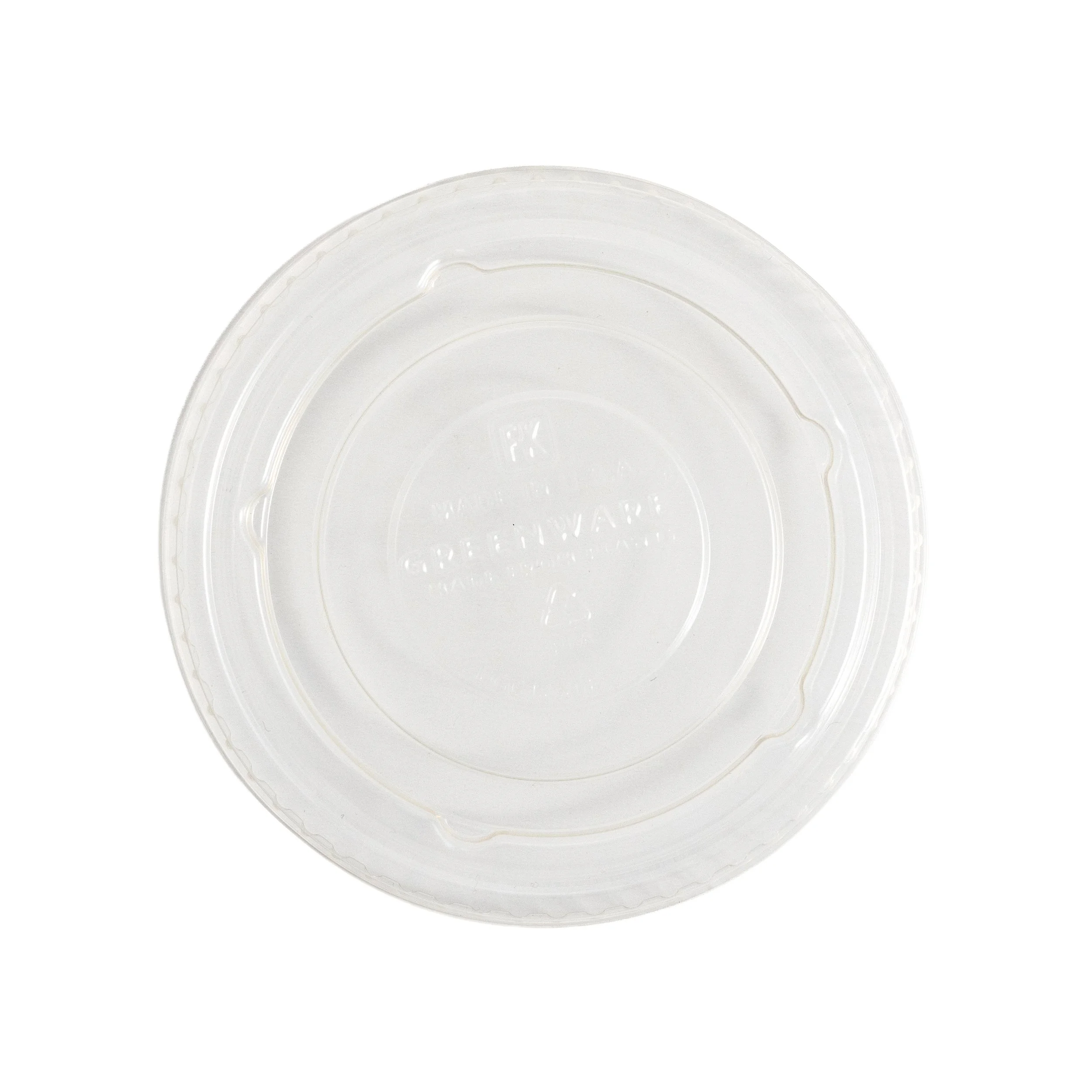 Close-up of a clear, round plastic container or lid with ridges around the edge, against a white background.