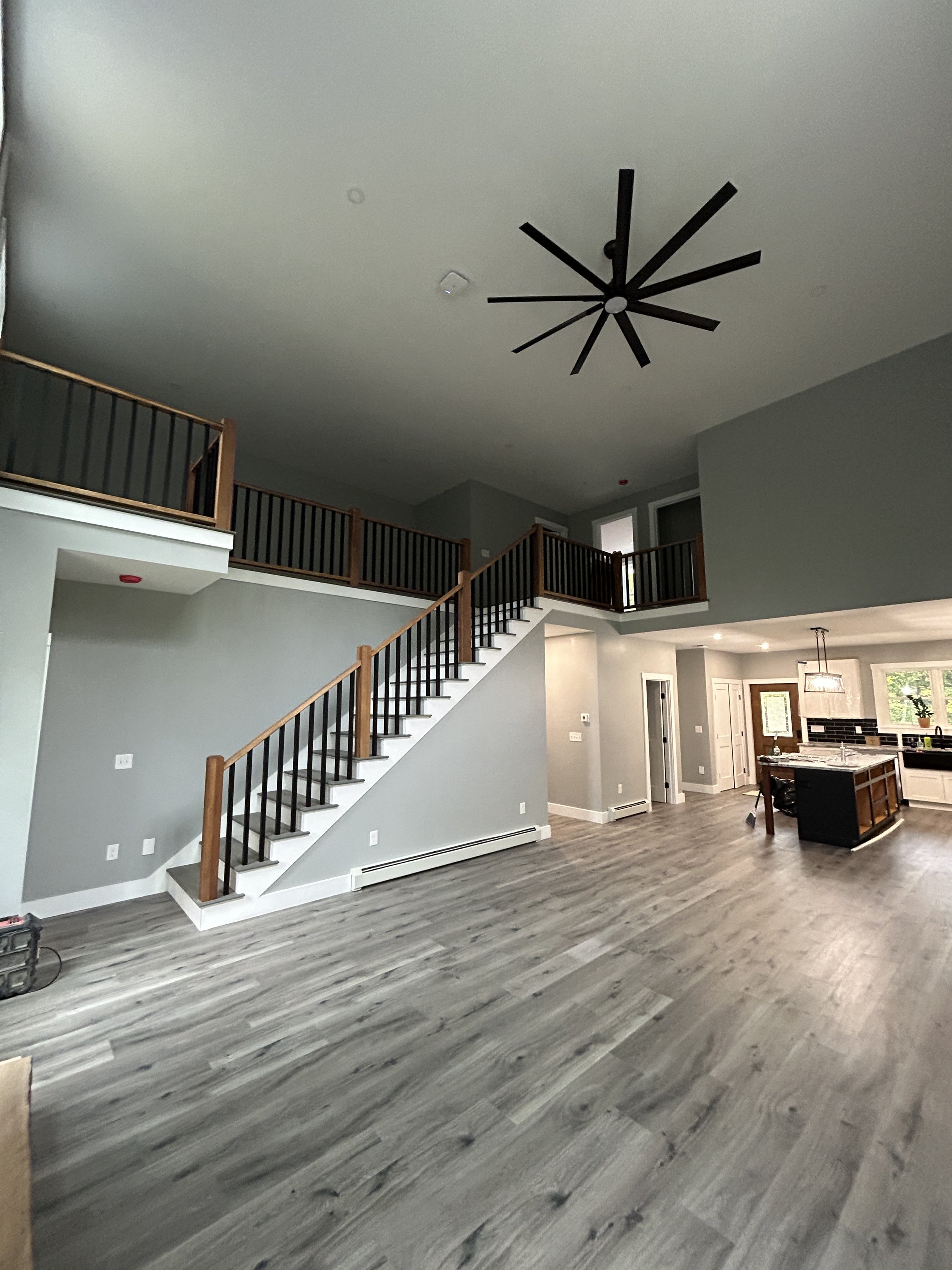 Avex Custom Homes, Raymond Maine, Custom Home Build, Flooring, Staircase, Railings, Ceiling Fan, Cabinets, Countertops, New Home, Construction. Maine Builder