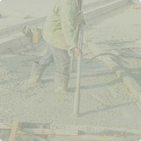 Construction worker pouring concrete on a construction site.
