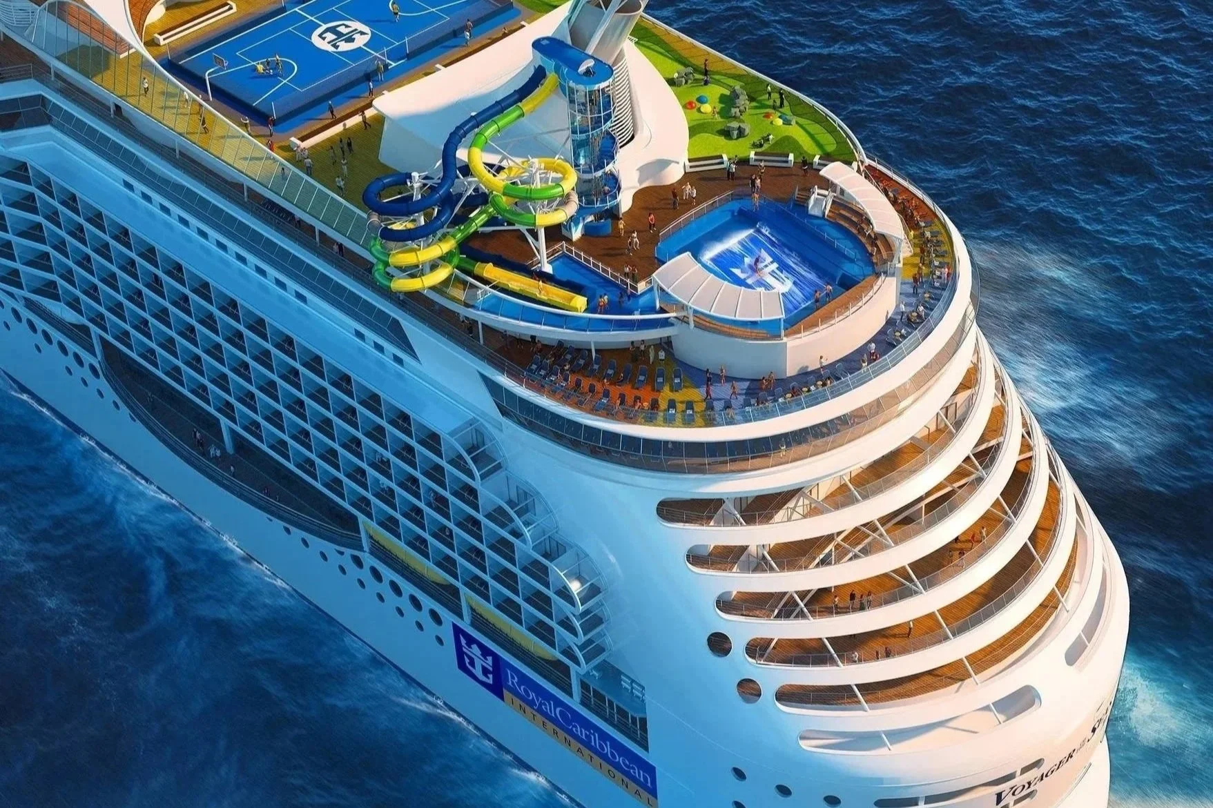 Aerial view of a cruise ship at sea featuring a water slide, pool, sports court, and multiple decks with passenger balconies.