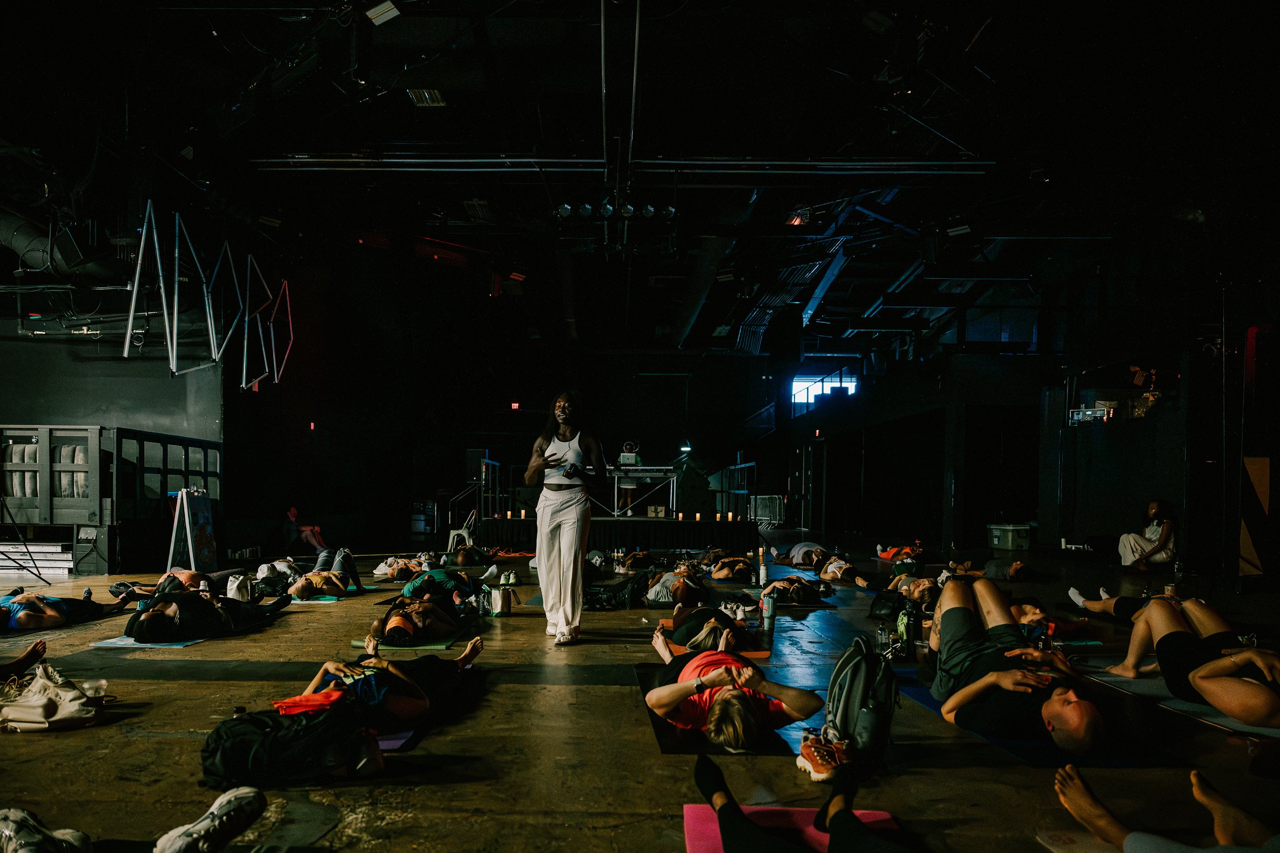 Rachel Okotete leading a group breathwork and meditation experience