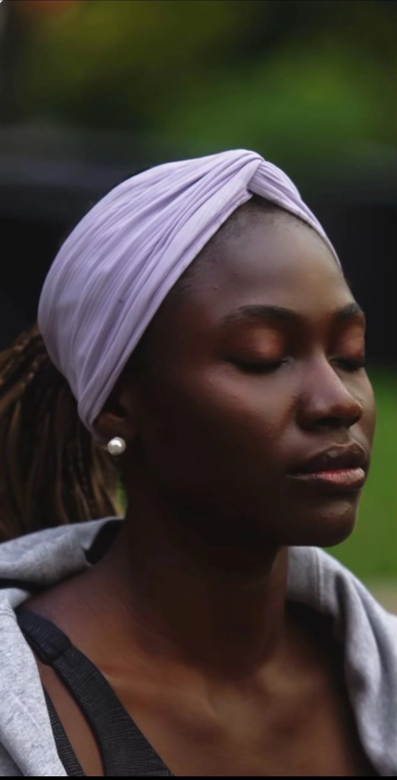 A portrait of Rachel Okotete, yoga teacher and breathwork facilitator.