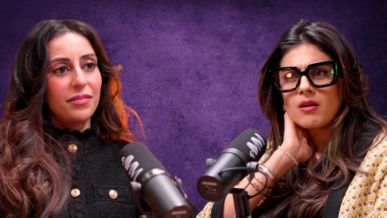 Two women seated at microphones during a podcast or radio interview, with a purple textured background.