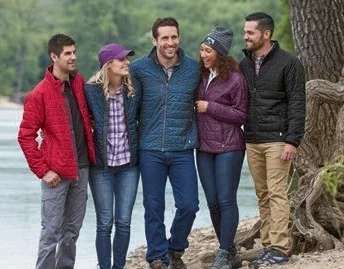 Group of men and women standing outside in Storm Creek custom branded jackets.