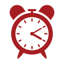 Red alarm clock showing 3:10.
