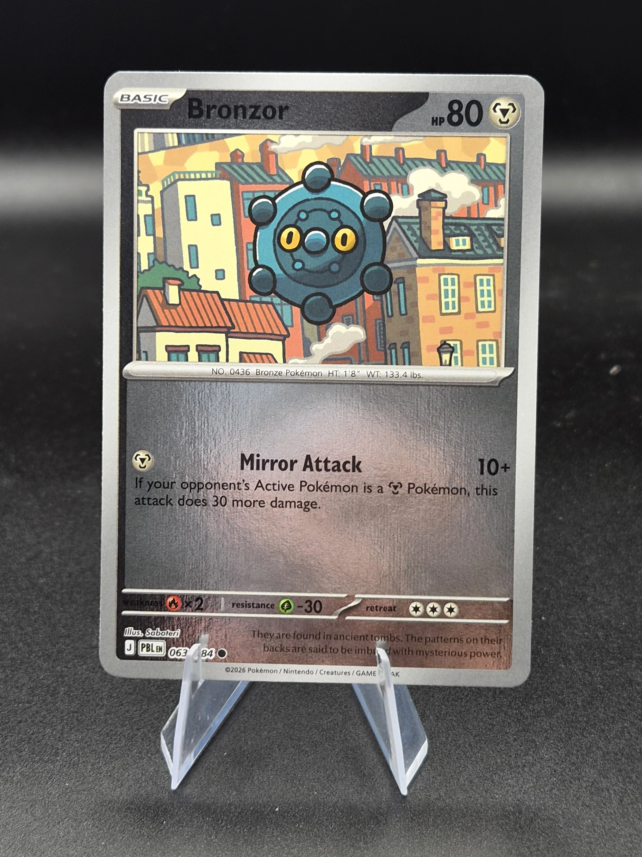 Bronzor 063/084 Pitch Black Common Reverse Holo Pokémon Card