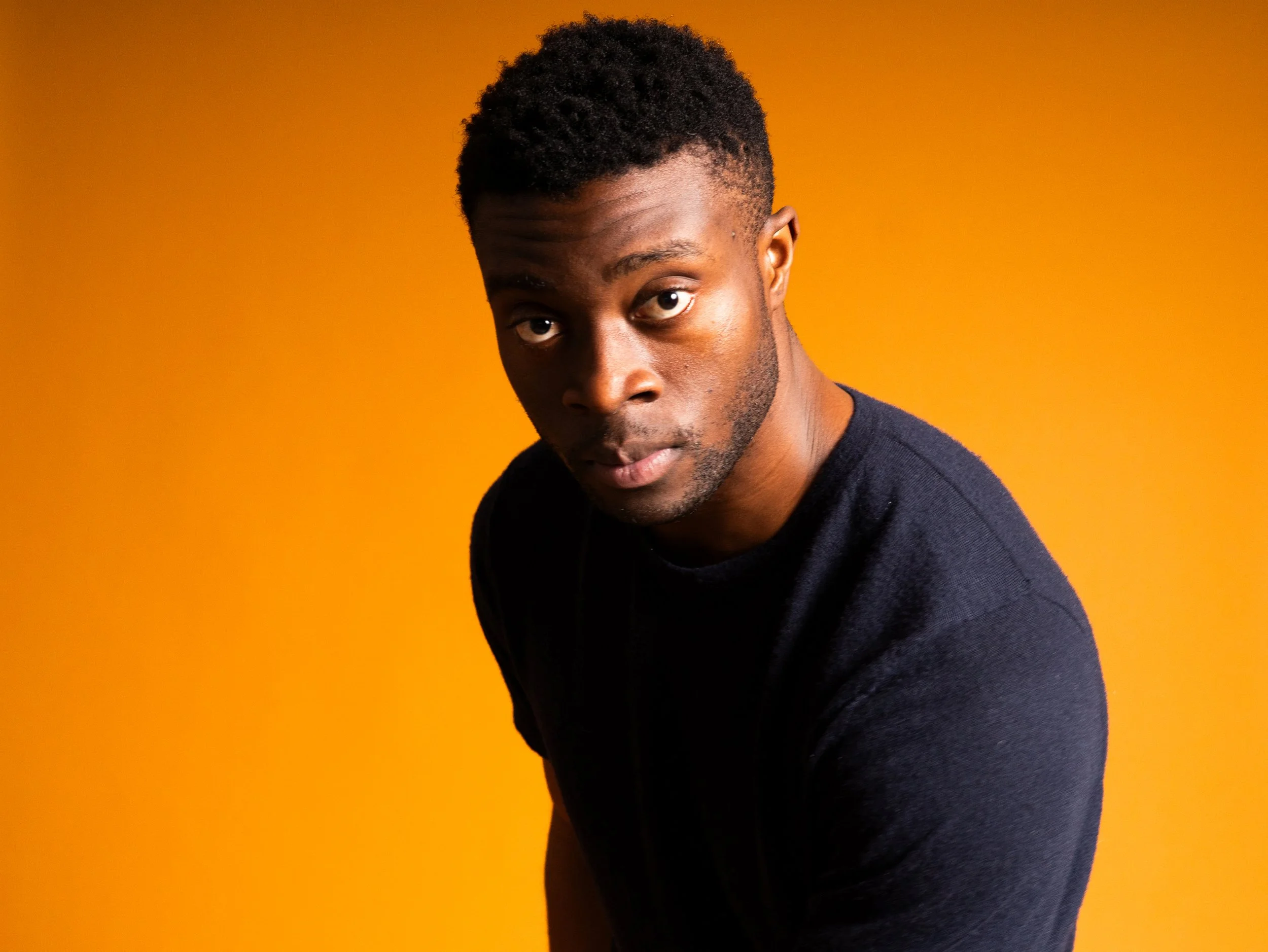 studio photo  on orange background, waist up