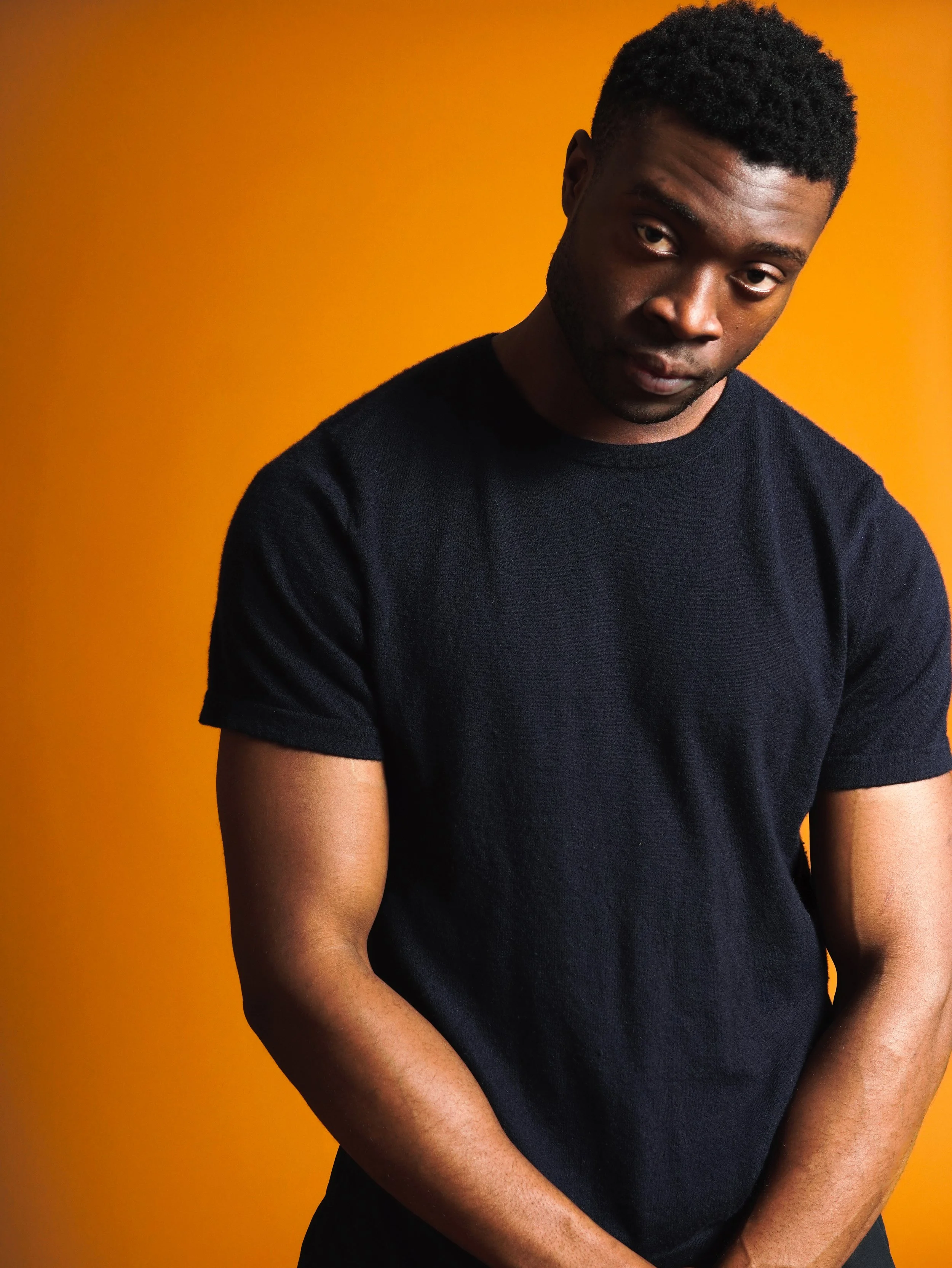 studio photo on orange background, profile shot