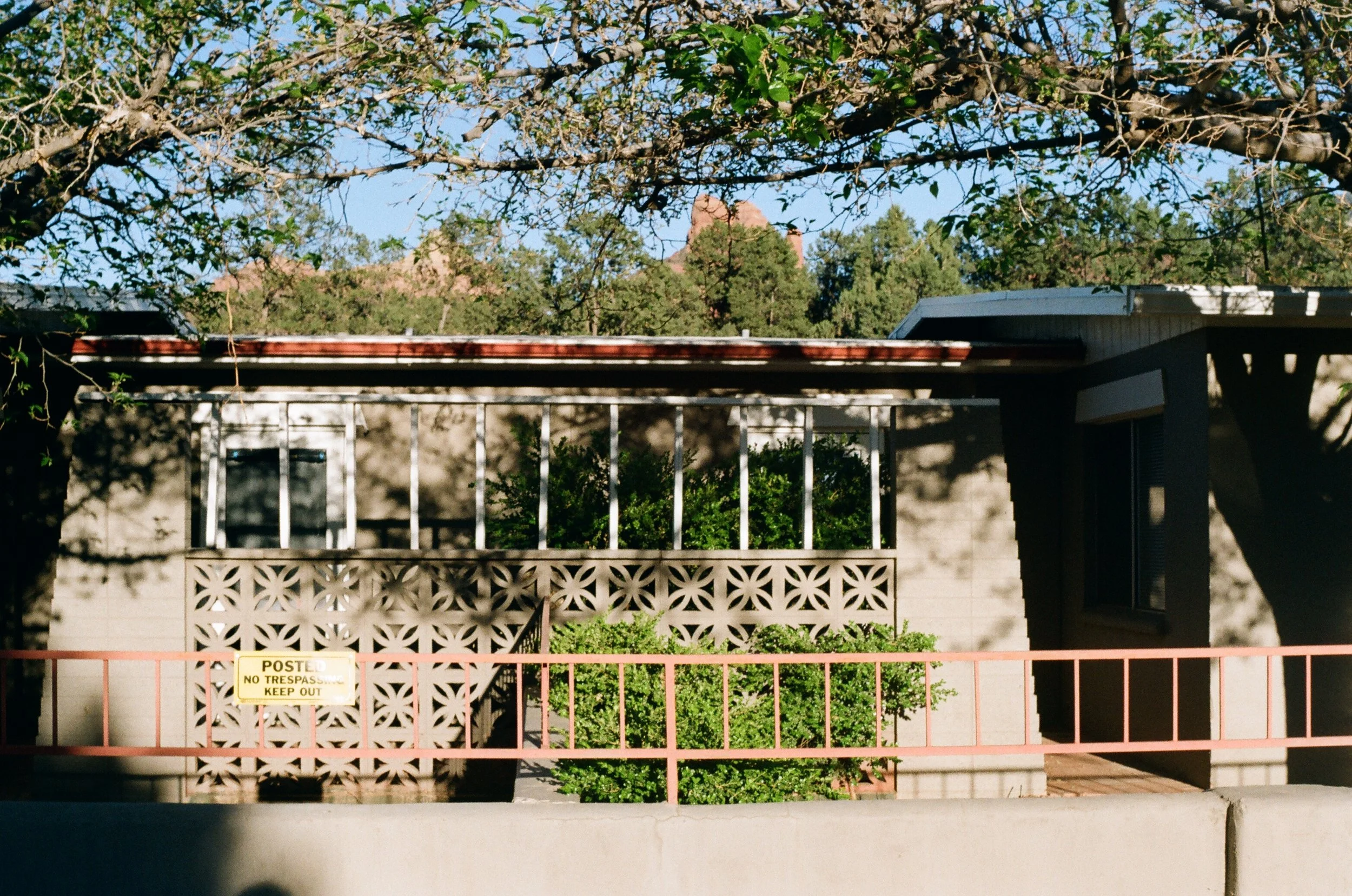 Picture of a fence, and wainscotting in front of a building by jctakiff photographer