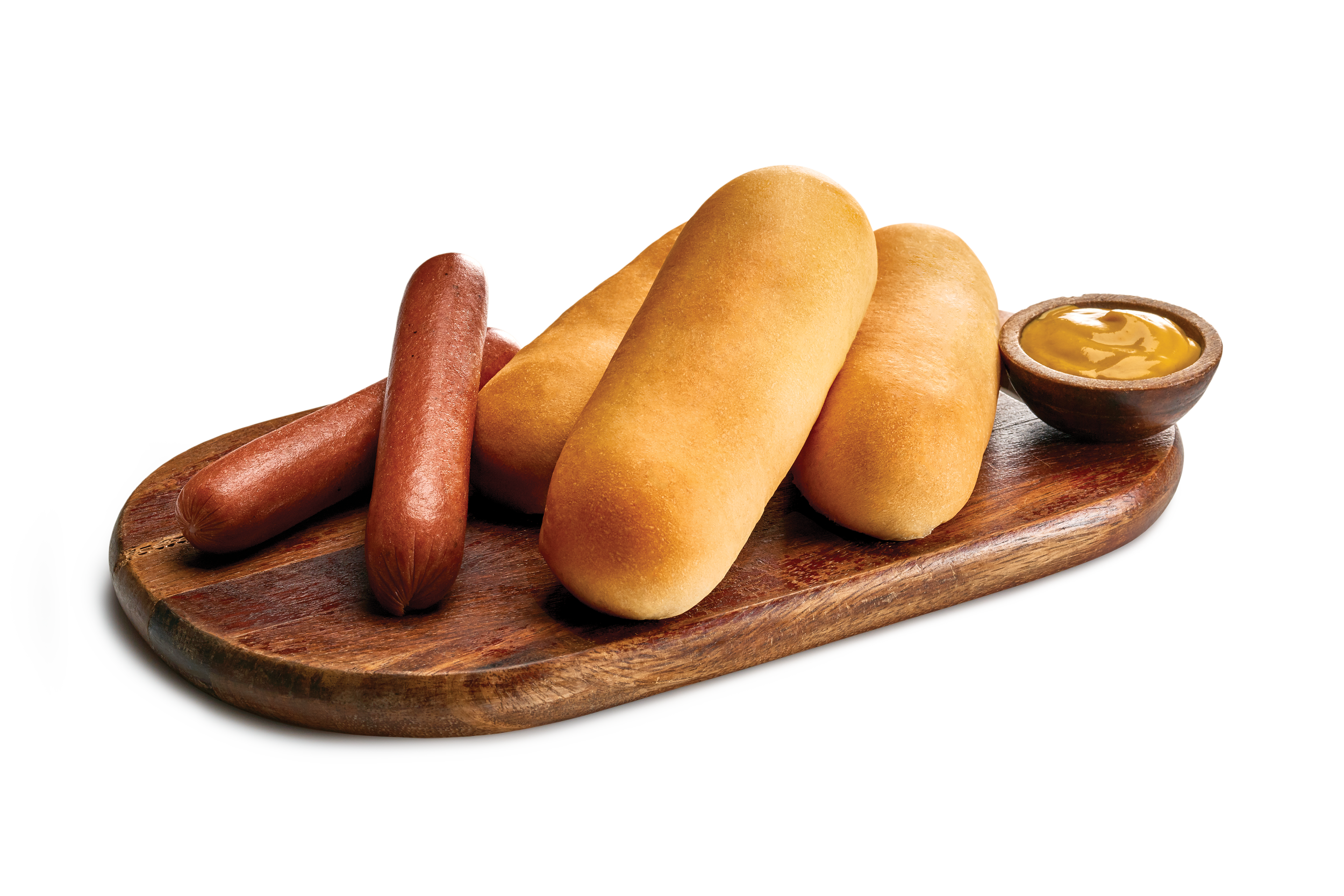 Three polish sausages on a wooden serving tray with a cup of sauce.