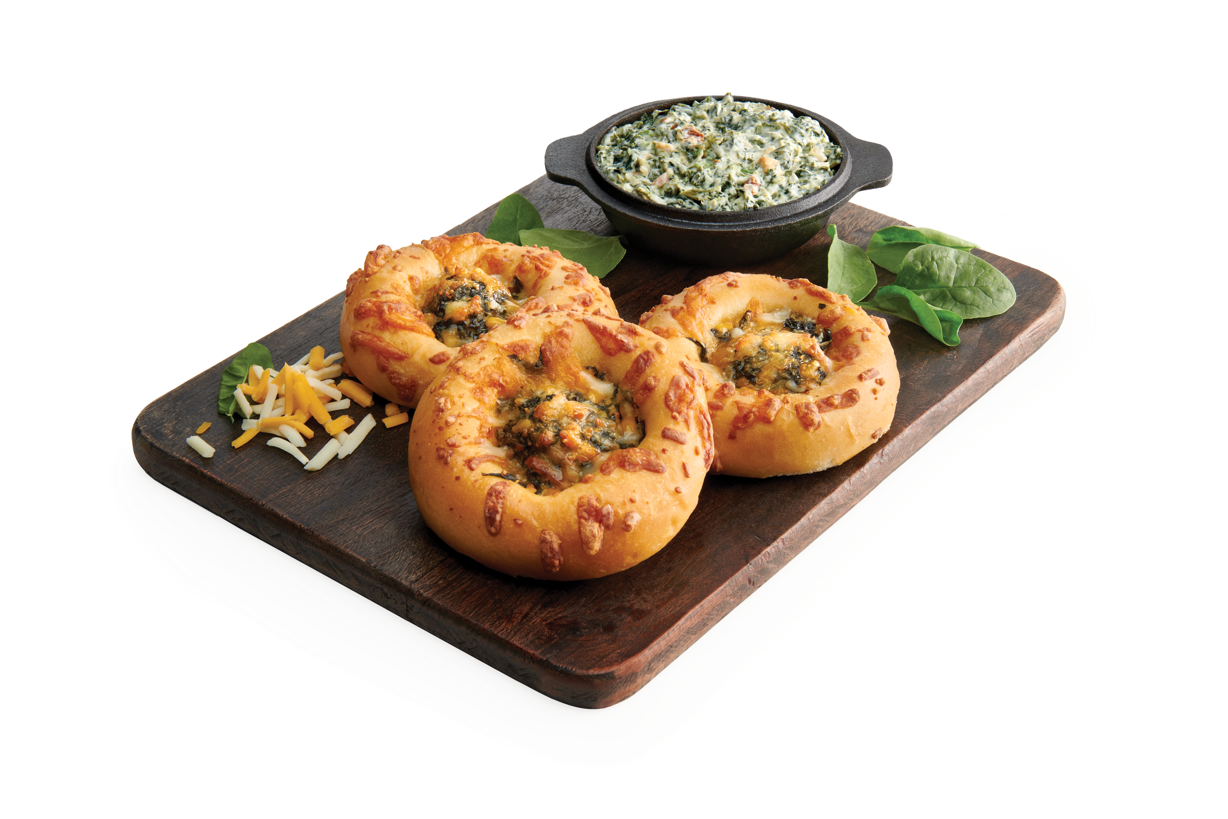 Three kolaches filled with spinach dip on a wooden serving tray with a bowl of spinach dip.