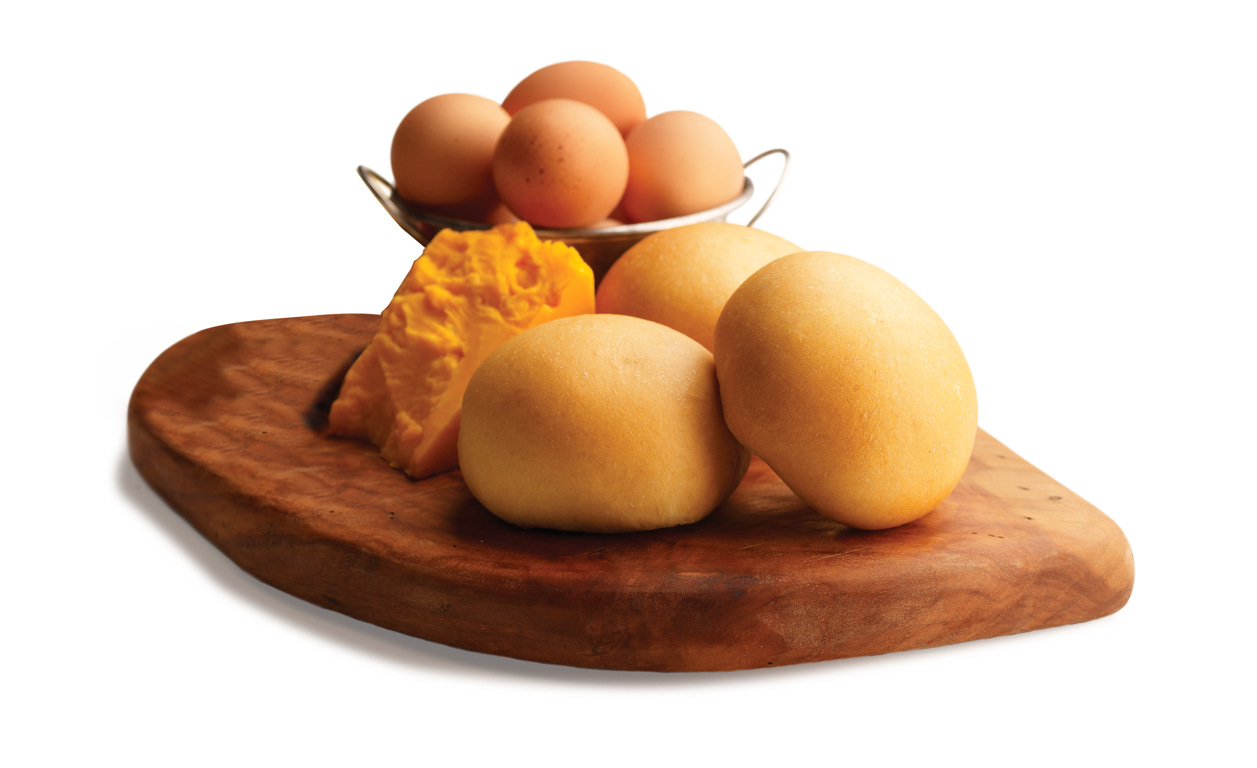 Three kolaches on a wood serving tray with cheese and eggs.