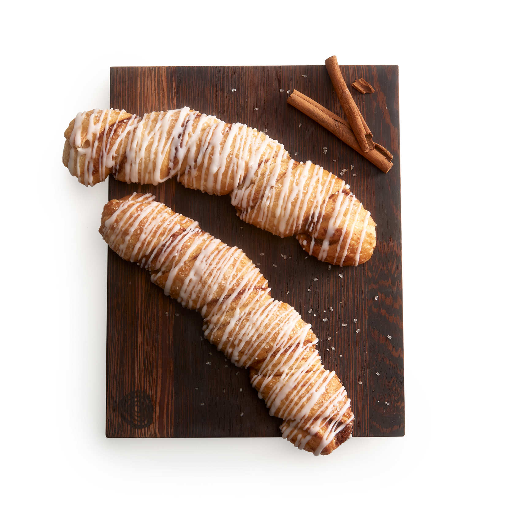 Tray with two cinnamon twists drizzled with icing.
