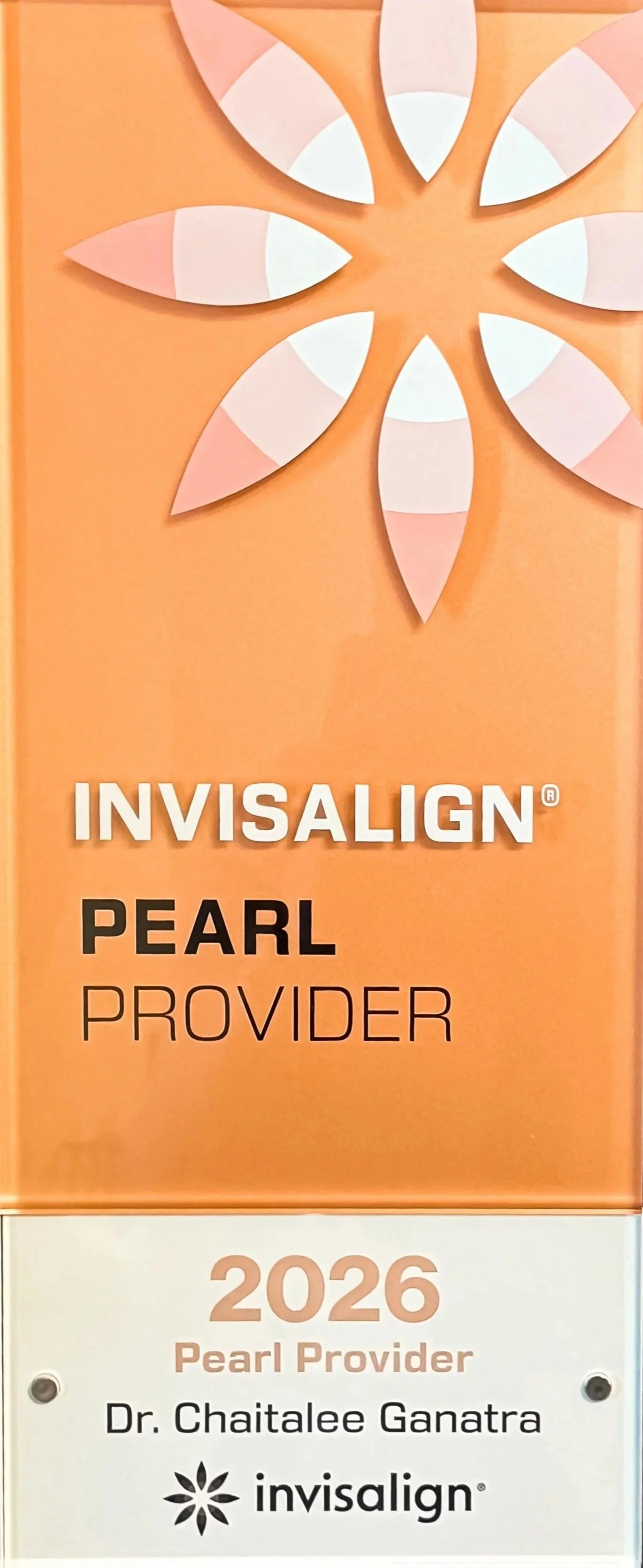 Sign for Invisalign Pearl Provider 2026, Dr. Chaitalee Ganatra, with a decorative floral pattern at the top.