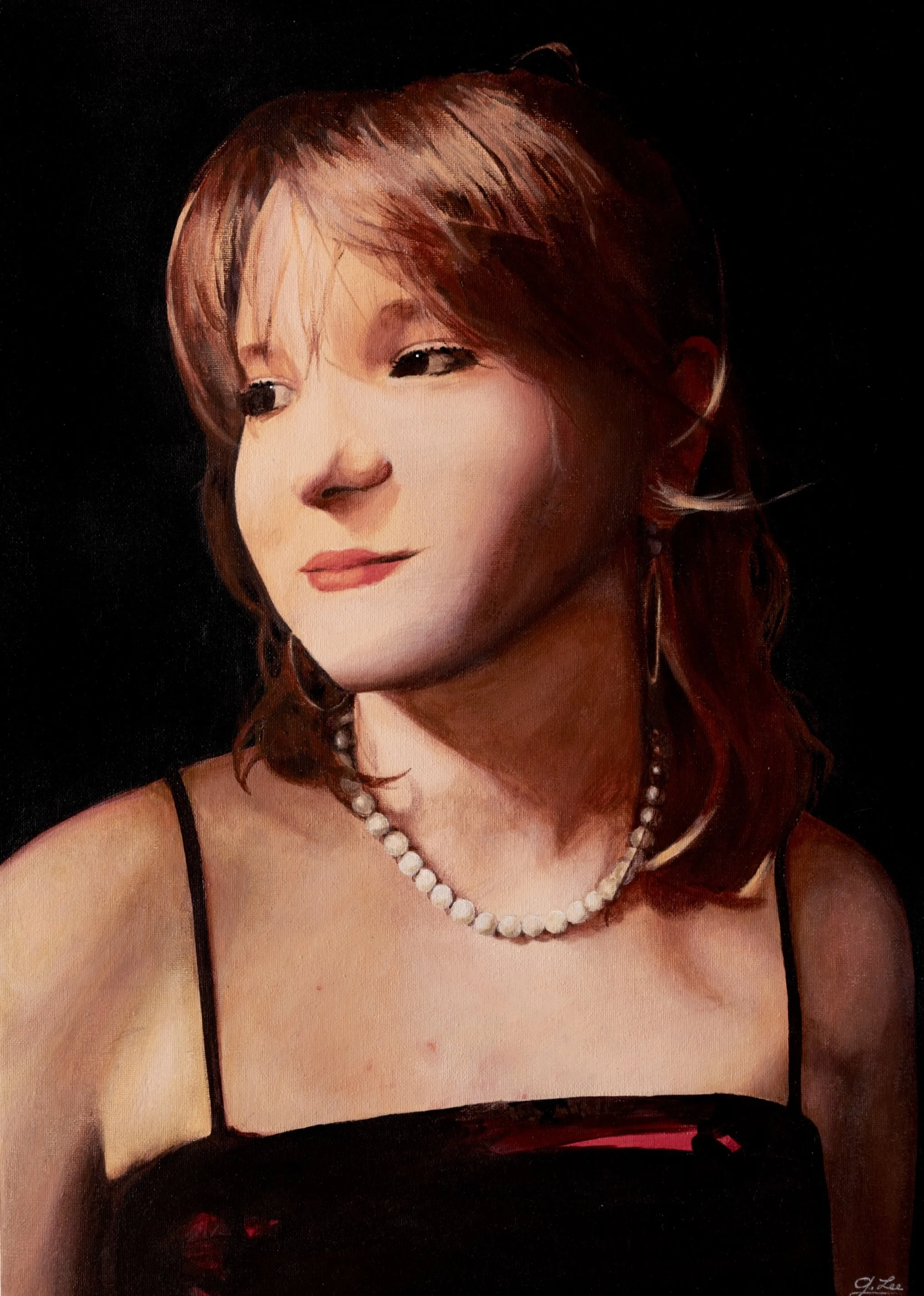 A portrait of a woman with orange hair wearing a black spaghetti strap dress, a pearl necklace, and earrings, against a dark background.