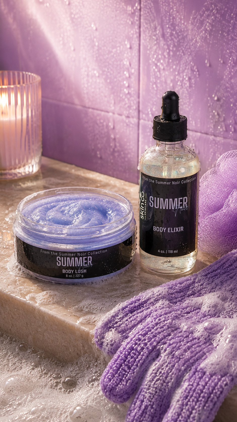 Summer Noir Body Lush and Body Elixir displayed with purple accents and a candle.
