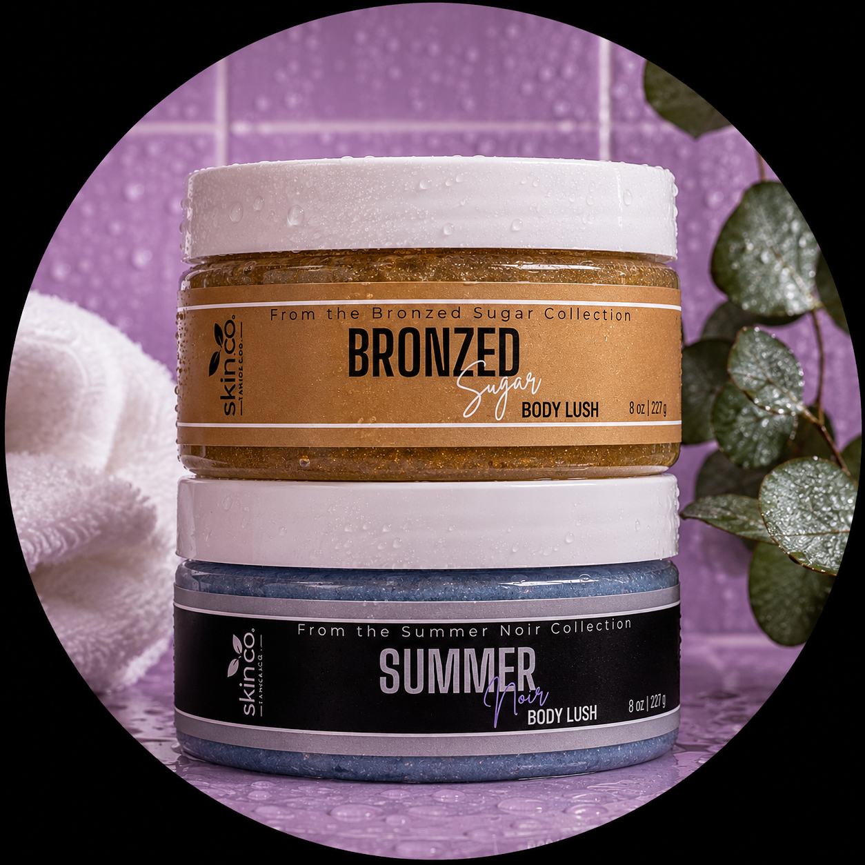 Stacked jars of Skinco body lush cream with water droplets and green leaves in the background.