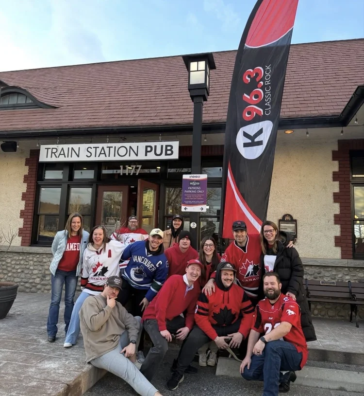Hockey fans in jerseys outside the Train Station Pub