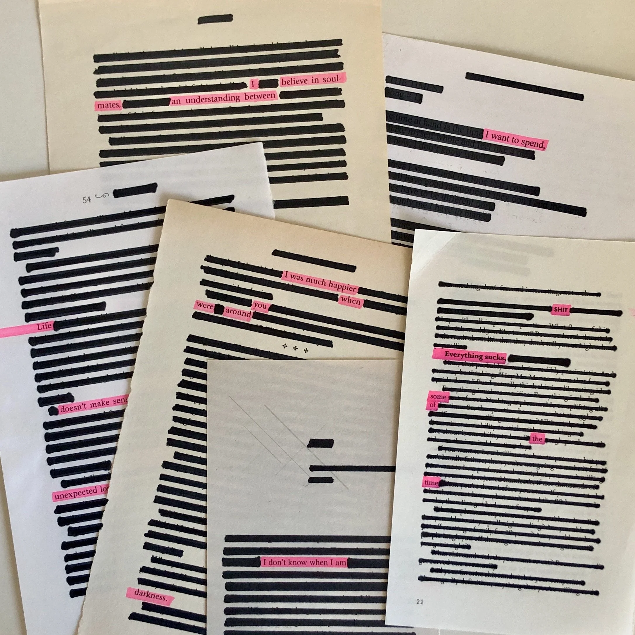 A collage of pages with blacked-out lines of text and pink highlighted words and phrases. Some visible words include 'believe in soul-mates,' 'I want to spend,' 'I don't know when I am,' and 'unexpected for.'