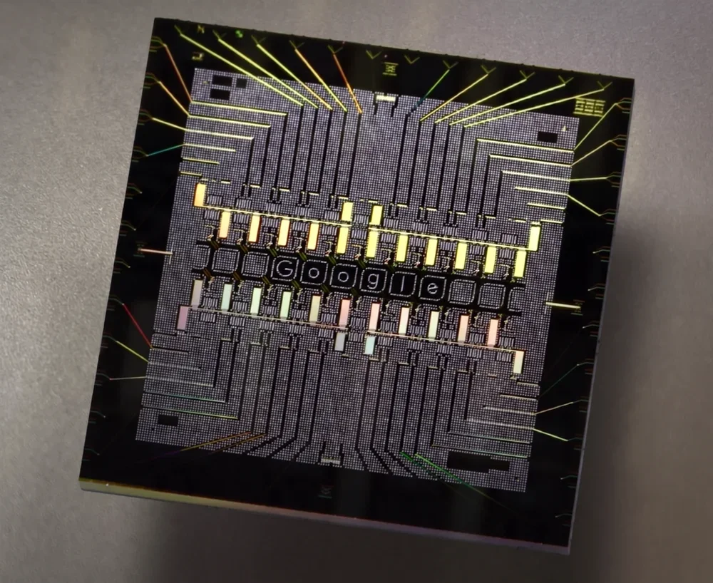Microprocessor chip with LED display spelling 'Google' and colorful circuit lines.