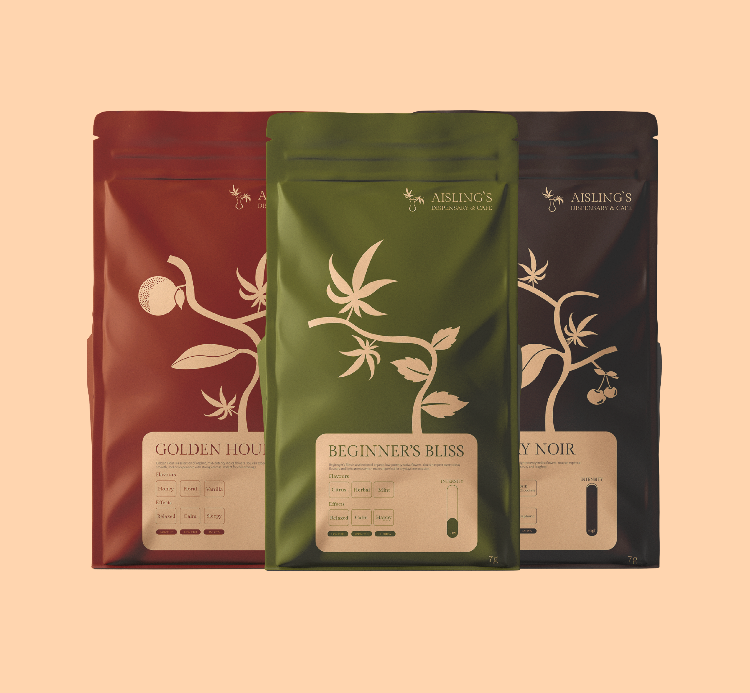 Three colorful packages of cannabis products from Aisling's Dispensary & Cafe with labels indicating different strains: Golden Hour, Beginner's Bliss, and Cherry Noir, against a peach background.