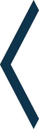 Close-up of a black and dark blue angular logo or symbol on a white background.